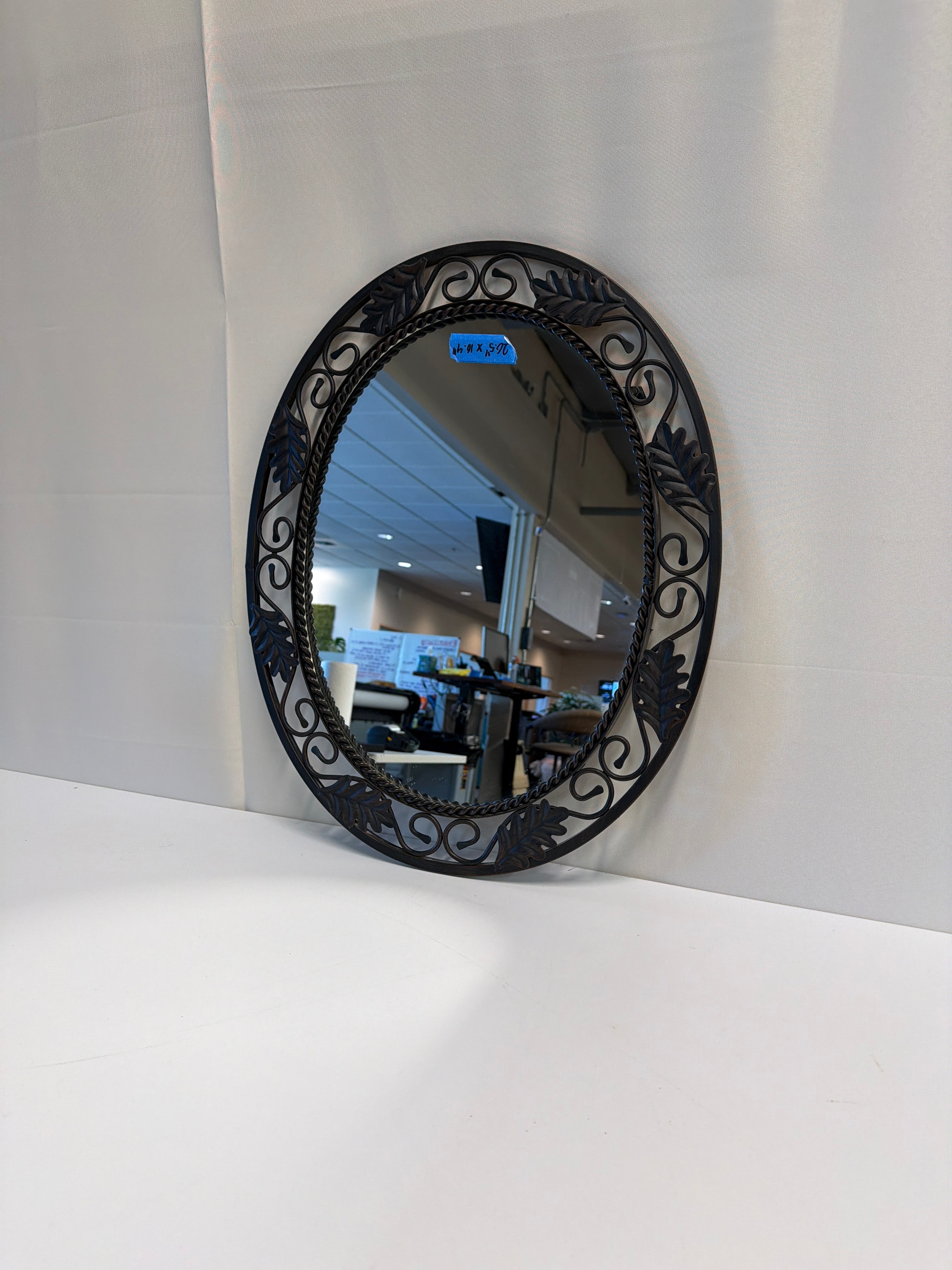 Ornate Oval Wall Mirror with Leaf and Scrollwork Frame