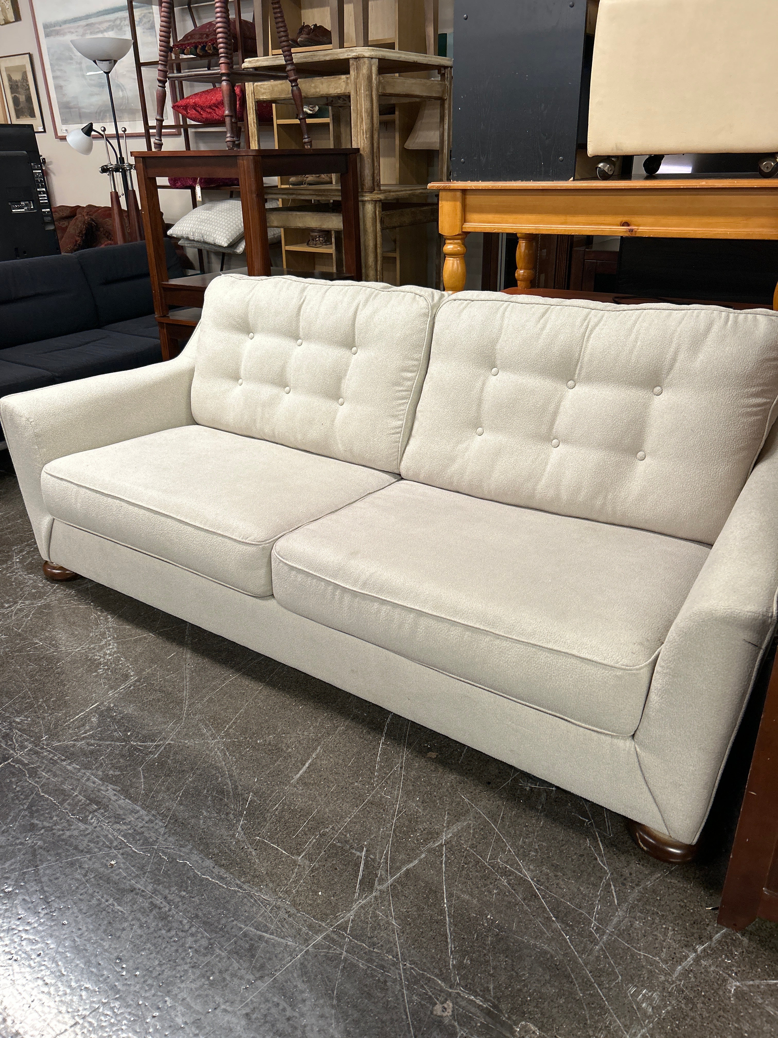 Ashley Furniture 2 Seat Cream Cloth Sofa