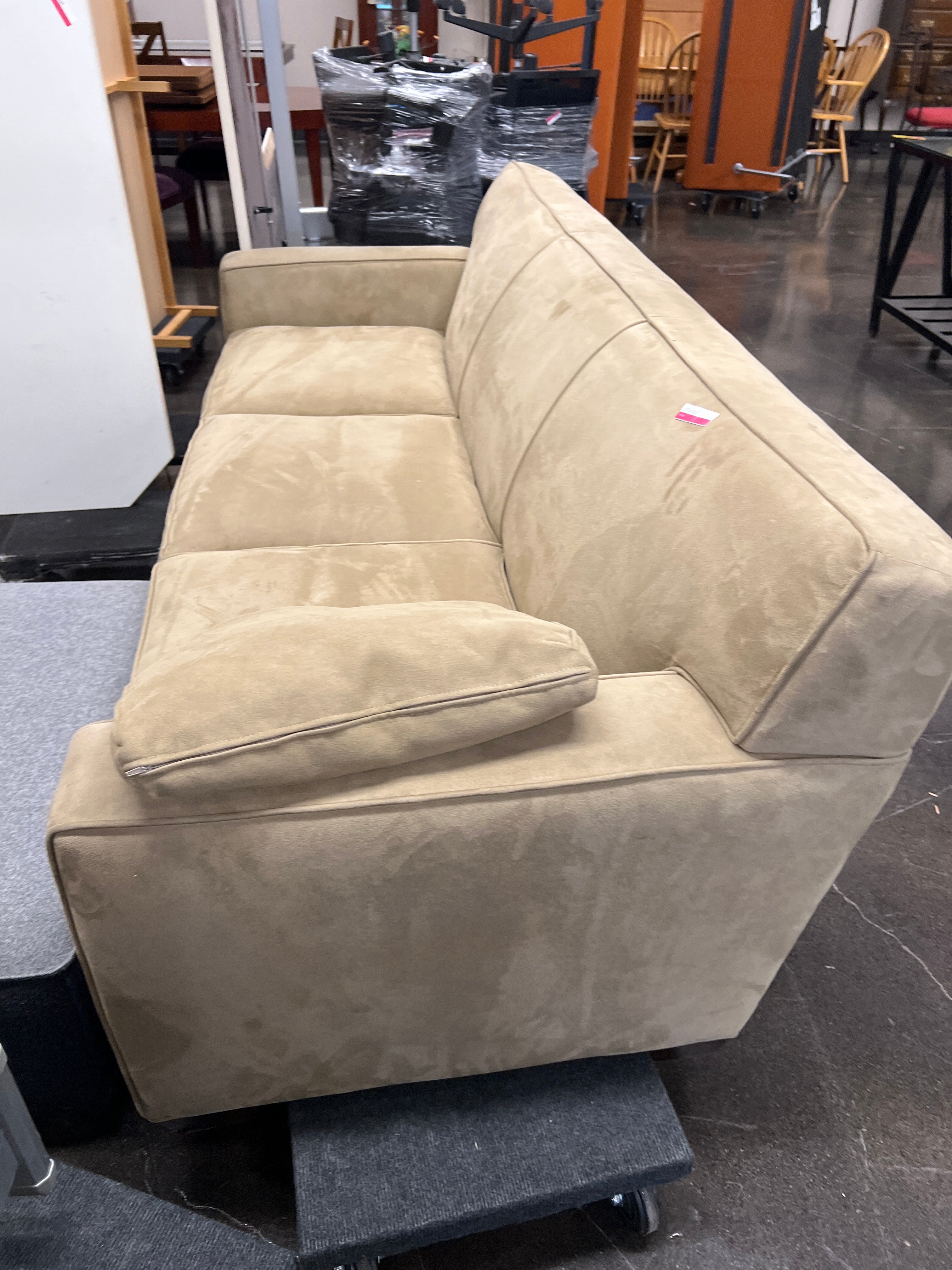 Brown three seat sofa