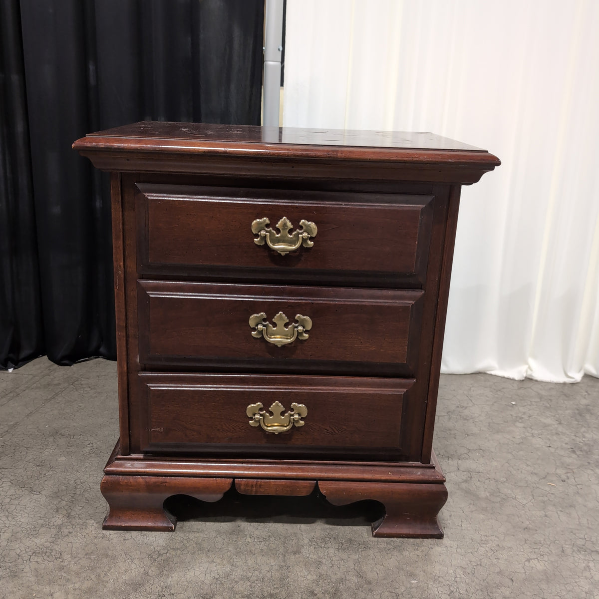 Dark Cherry Wood Nightstand with Ornate Hardware