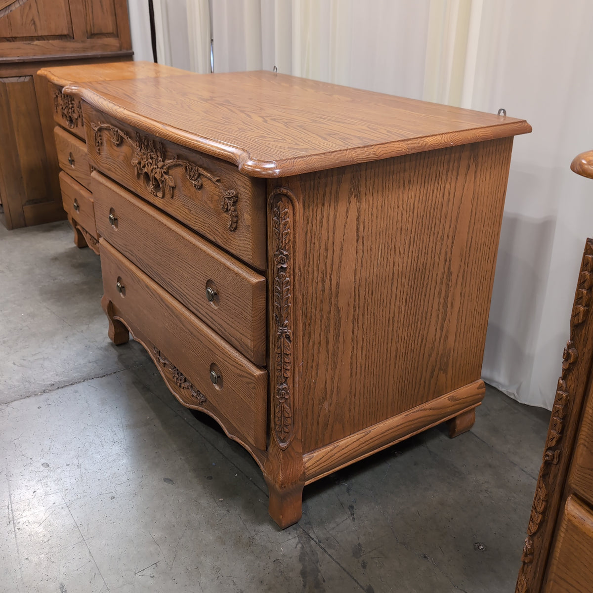 Ornate Carved Wood Three-Drawer Dresser with Floral Motifs