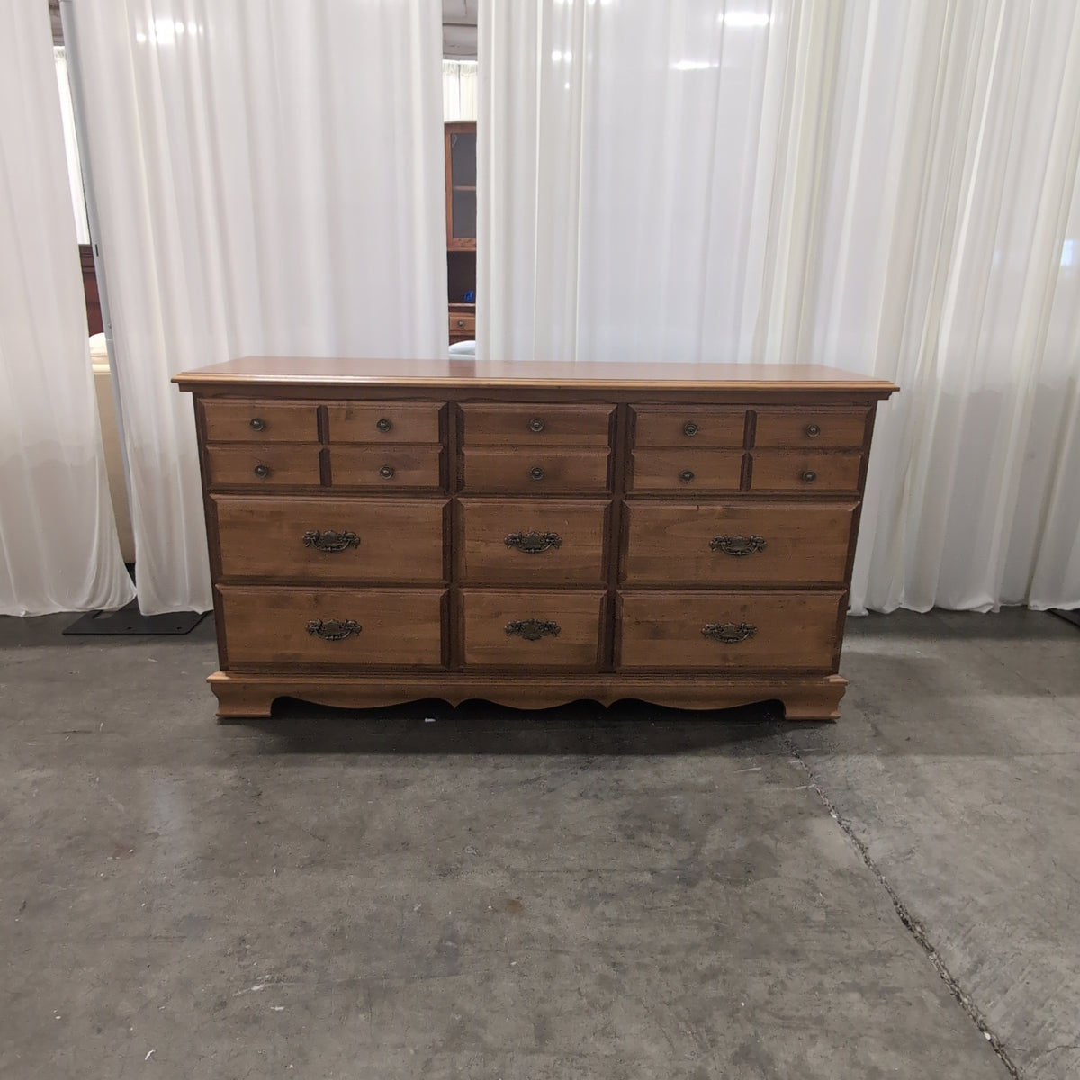 Traditional Brown Wood Nine-Drawer Dresser with Ornate Hardware