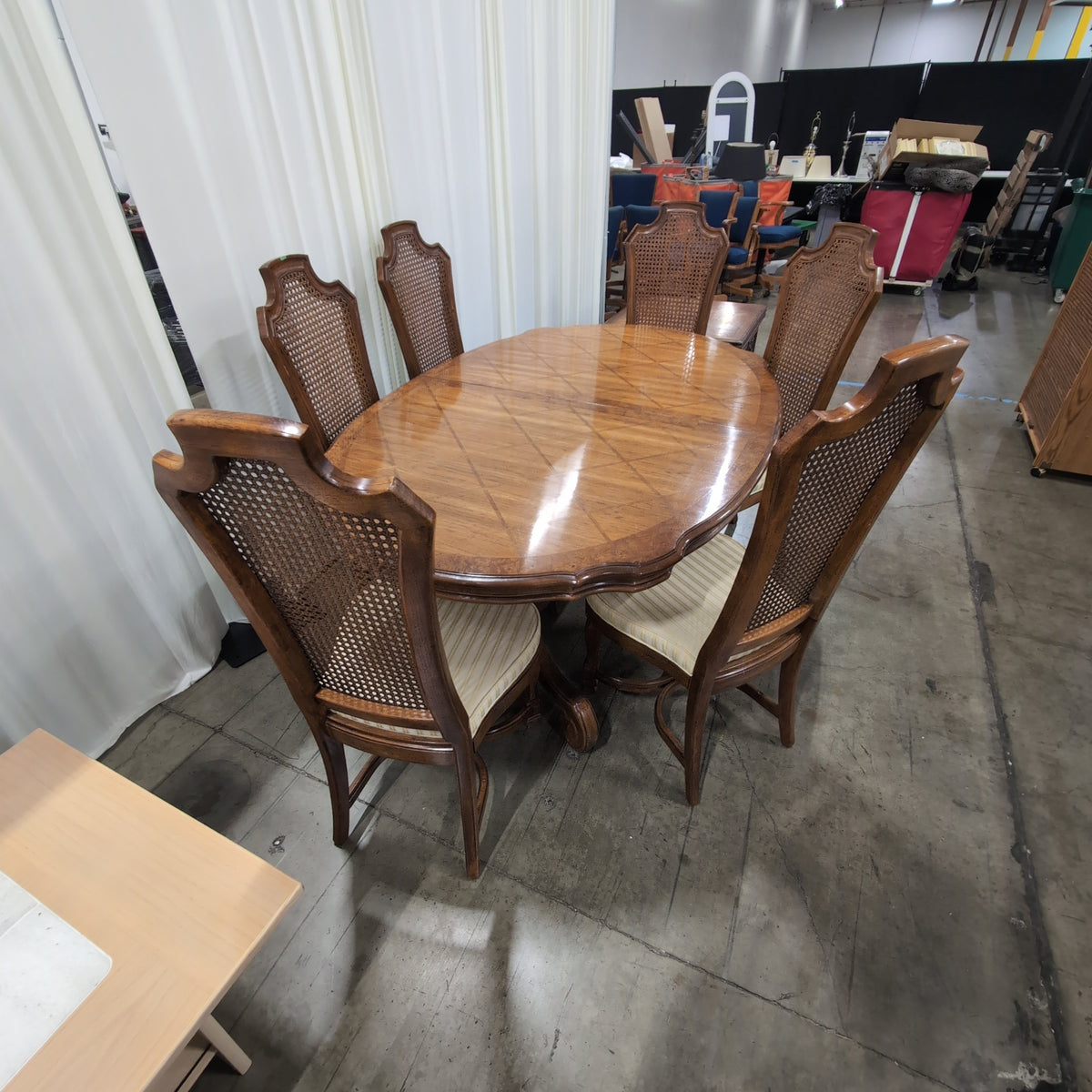 Ornate Brown Wood Dining Table With Six Cane Back Chairs