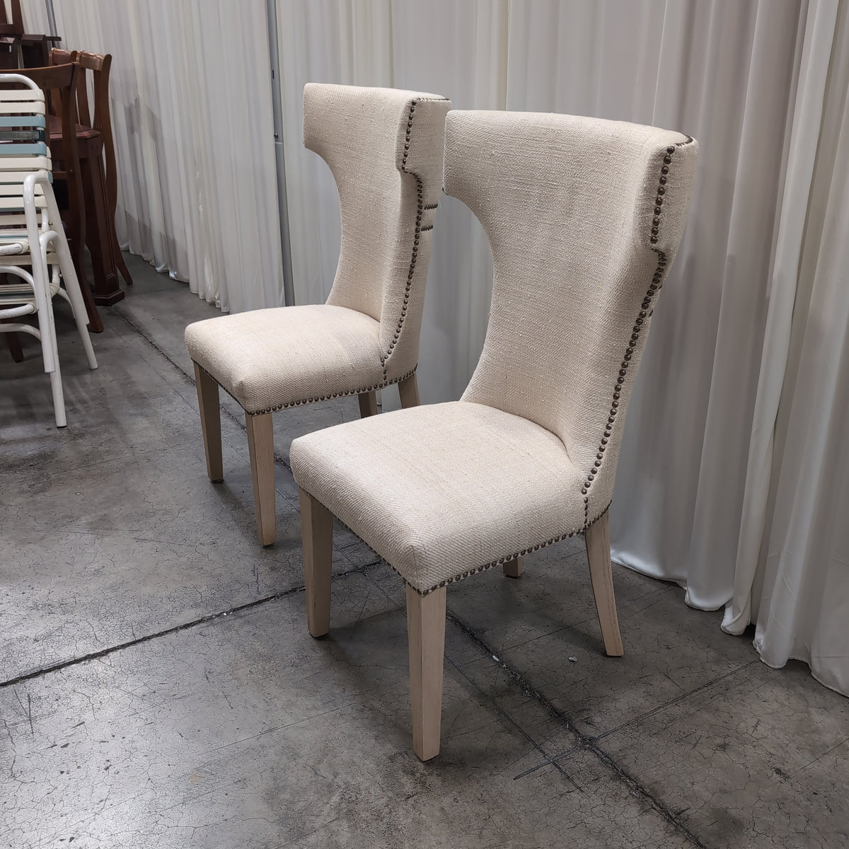 Light Beige Upholstered High-Back Chair with Nailhead Trim