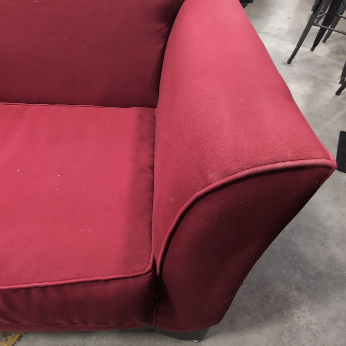 Red Fabric Upholstered Two-Cushion Couch