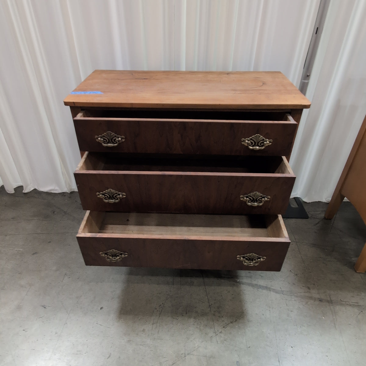 Antique Brown Wood Three-Drawer Dresser with Ornate Hardware