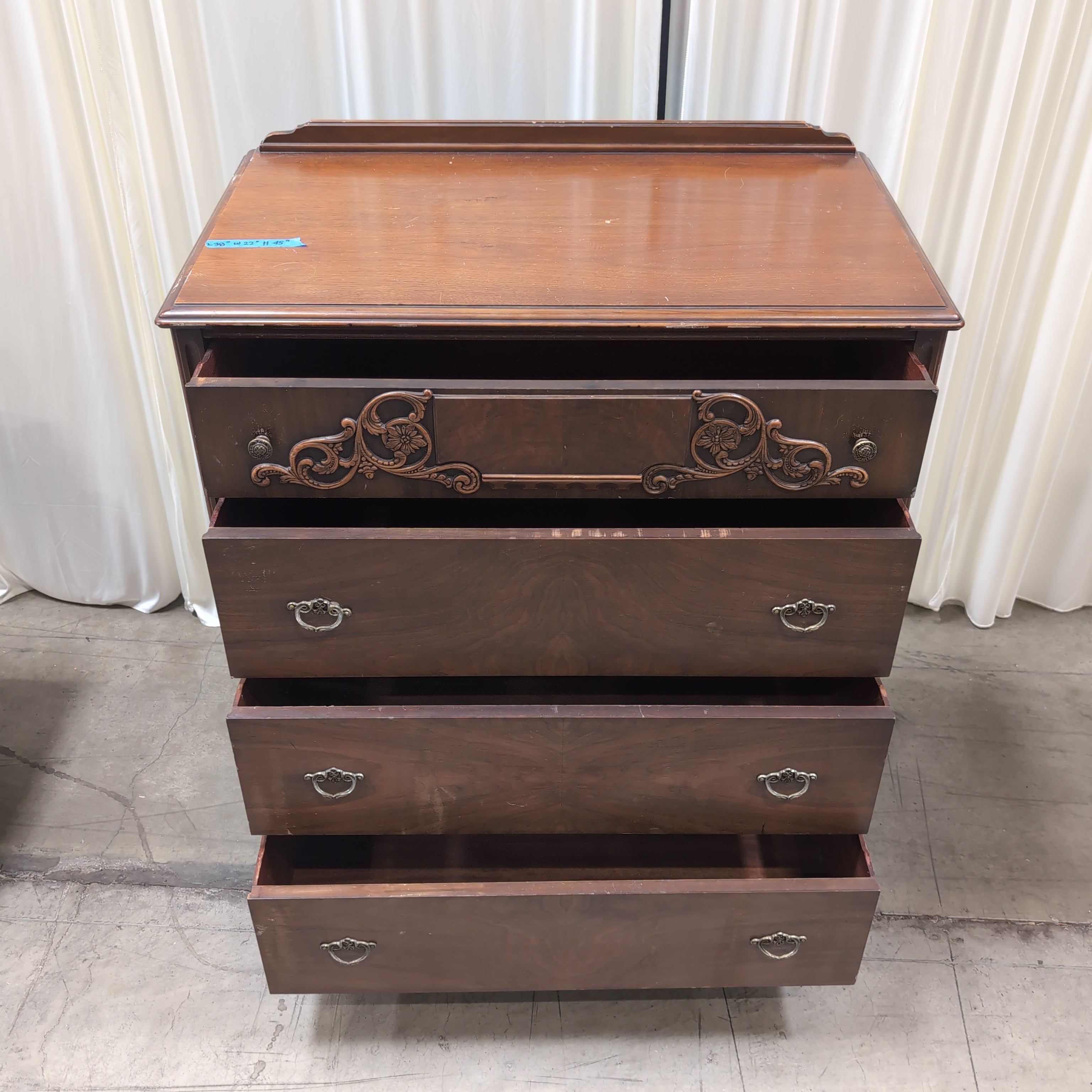 Vintage Dark Wood Four-Drawer Dresser with Ornate Carving