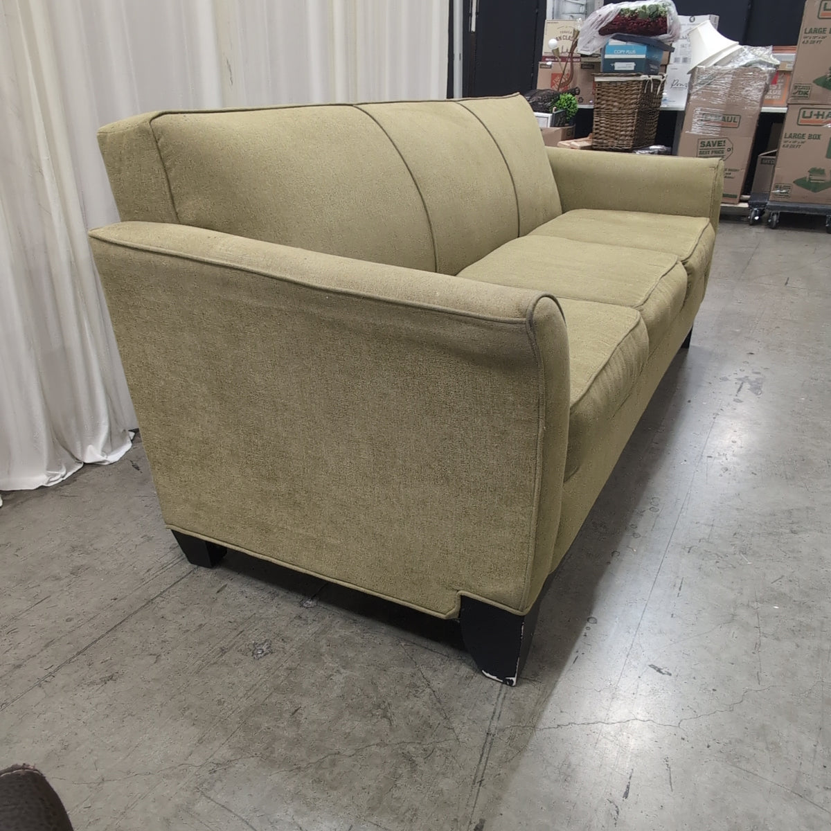 Tan Fabric Three-Cushion Couch with Rolled Arms