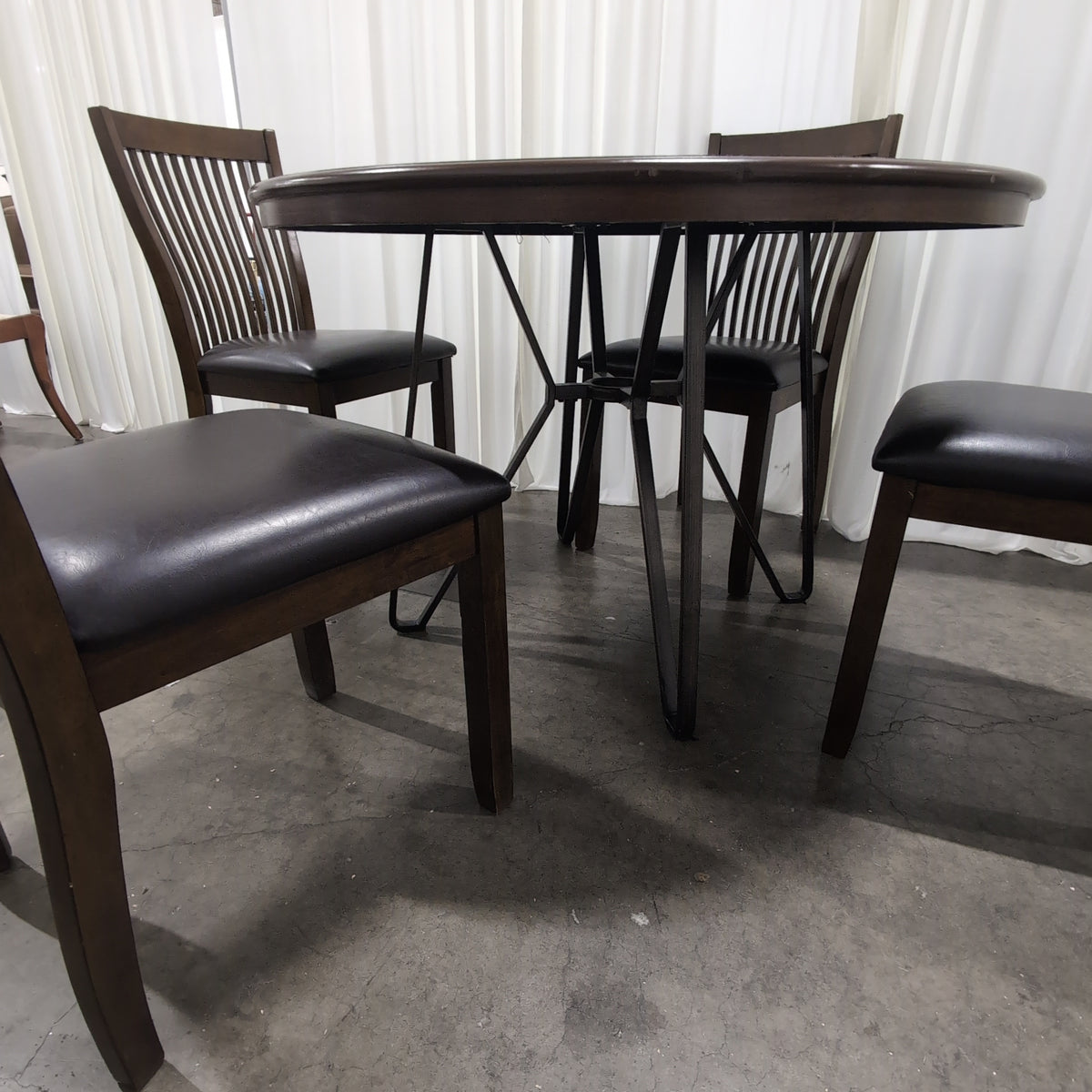 Round Dark Wood Dining Table with Sunburst Veneer