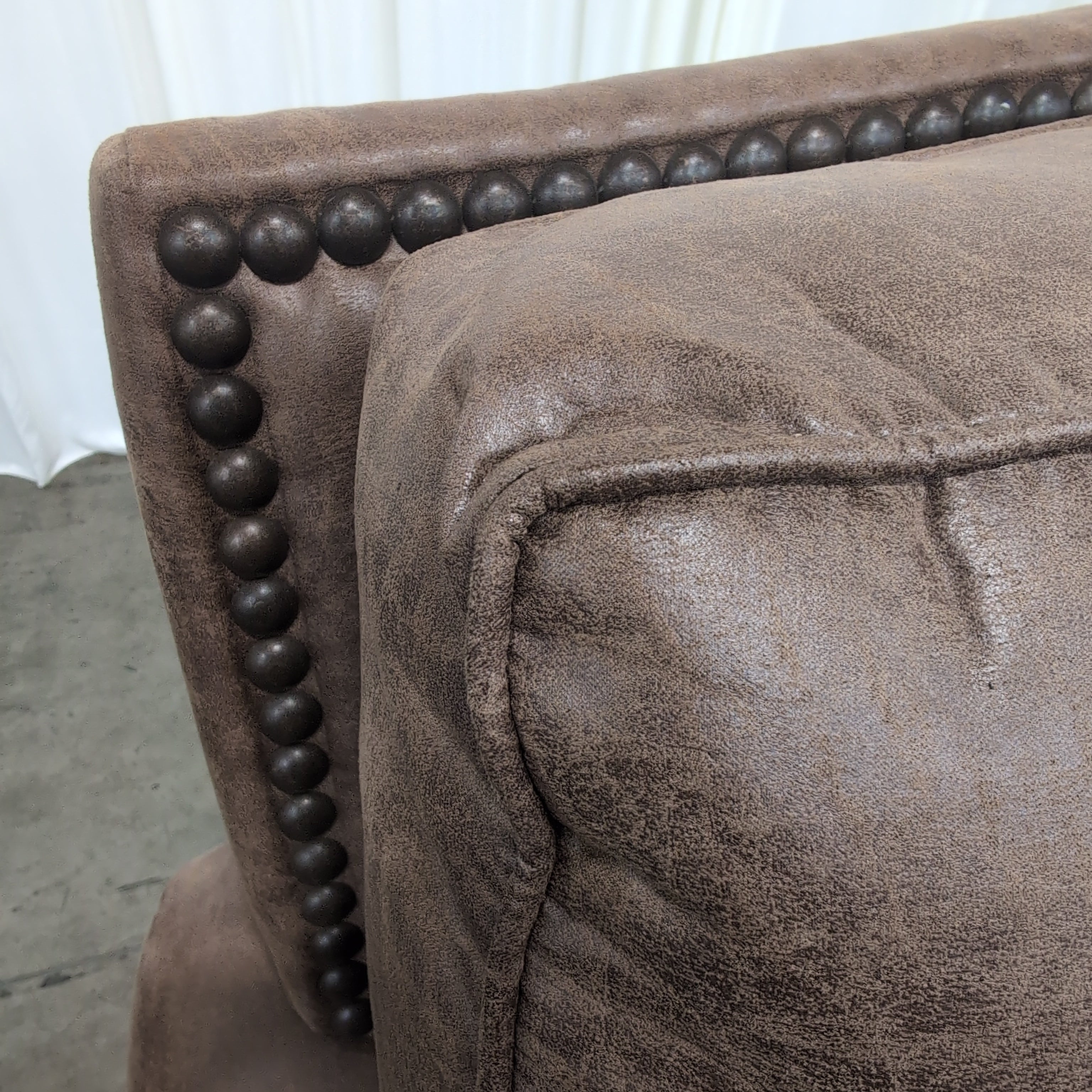 Tan Faux Leather Rolled Arm Loveseat with Nailhead Trim
