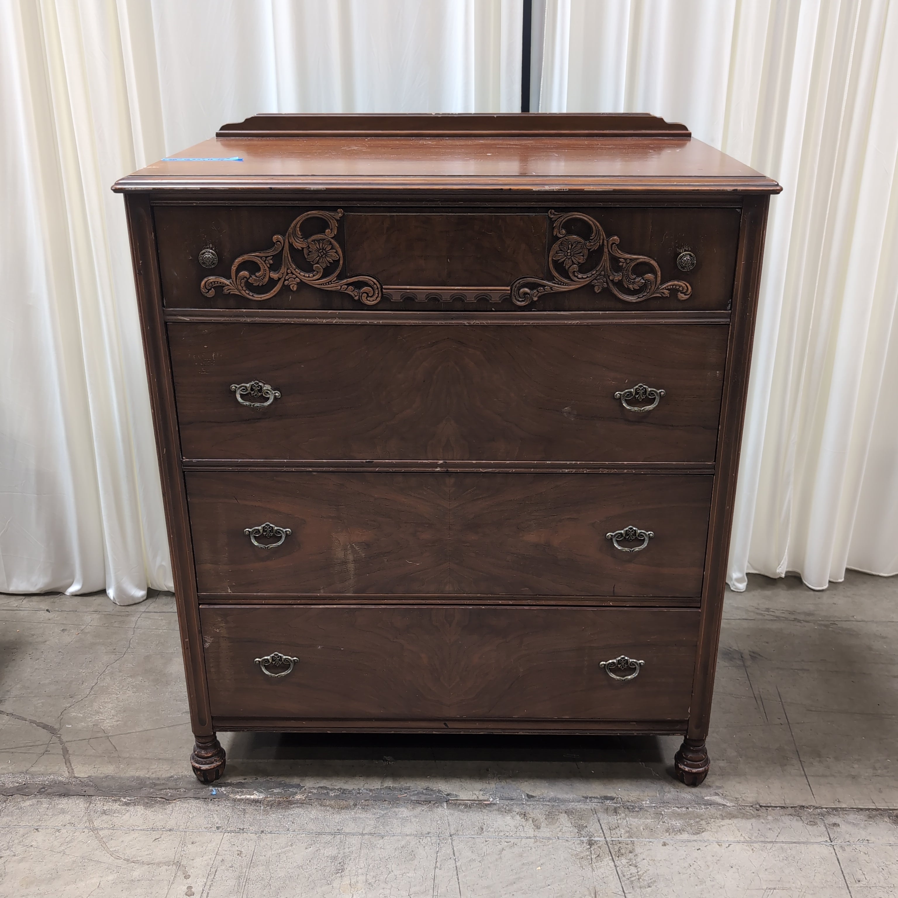 Vintage Dark Wood Four-Drawer Dresser with Ornate Carving