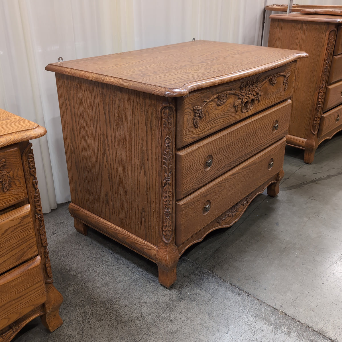 Ornate Carved Wood Three-Drawer Dresser with Floral Motifs
