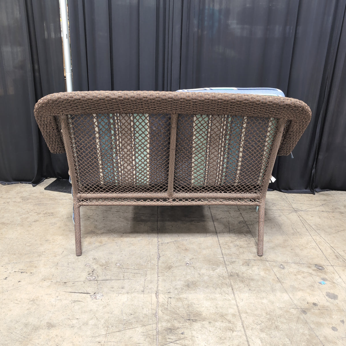 Dark brown wicker loveseat