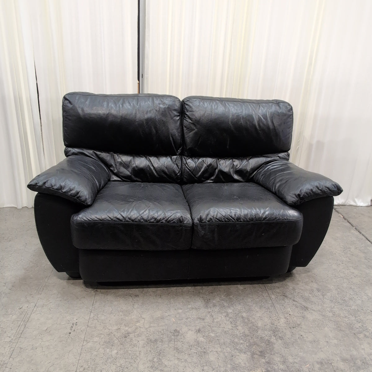Black Leather Three-Seat Couch with Padded Arms