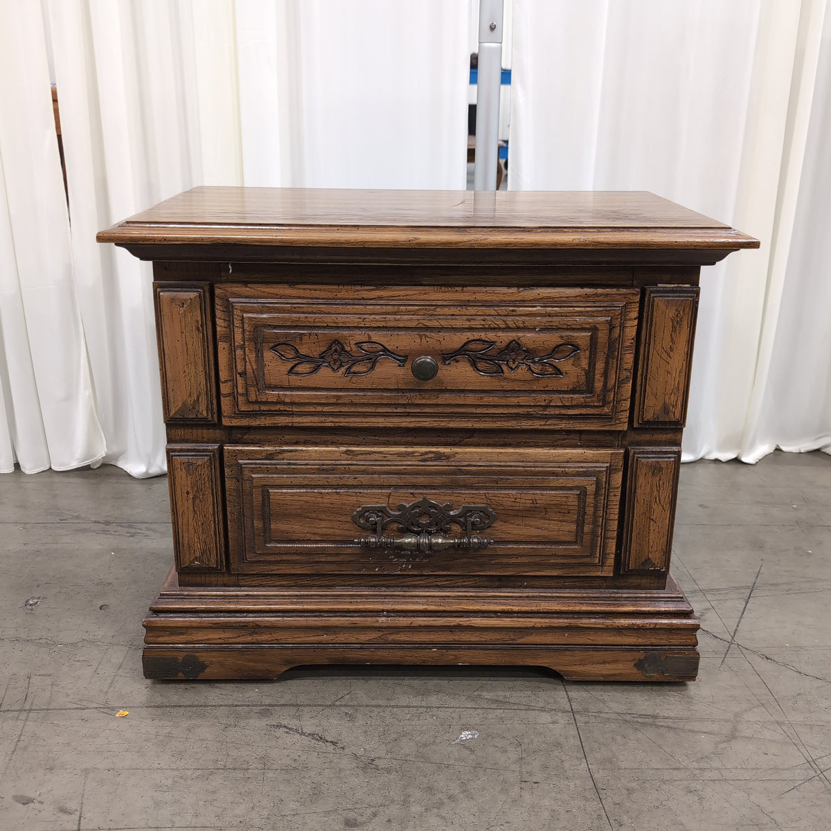 Traditional Dark Wood Two-Drawer Nightstand with Ornate Hardware