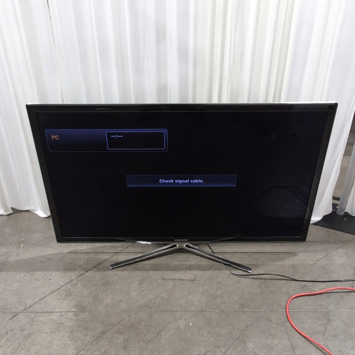 Samsung Black Flat Screen TV with Arch Stand