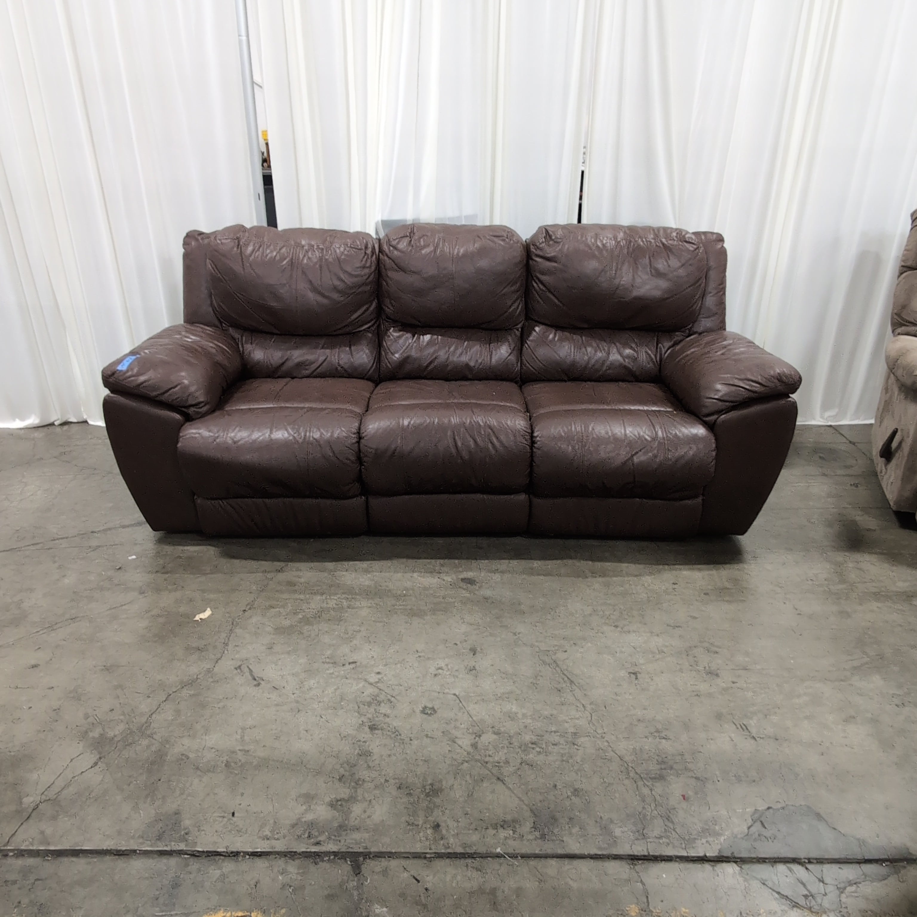 Brown Leather Three-Seat Recliner Couch