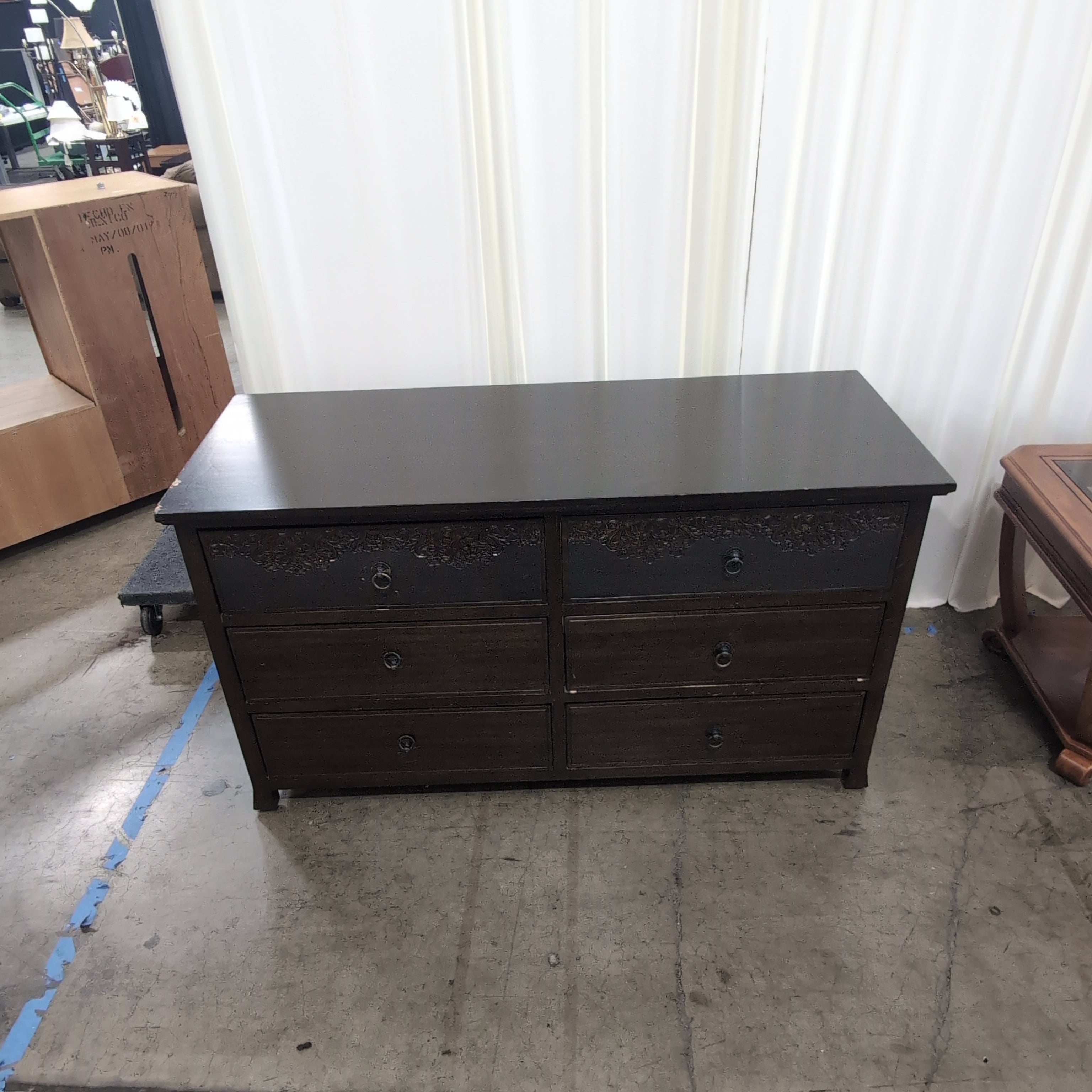 Dark Brown Six-Drawer Dresser with Ornate Carvings