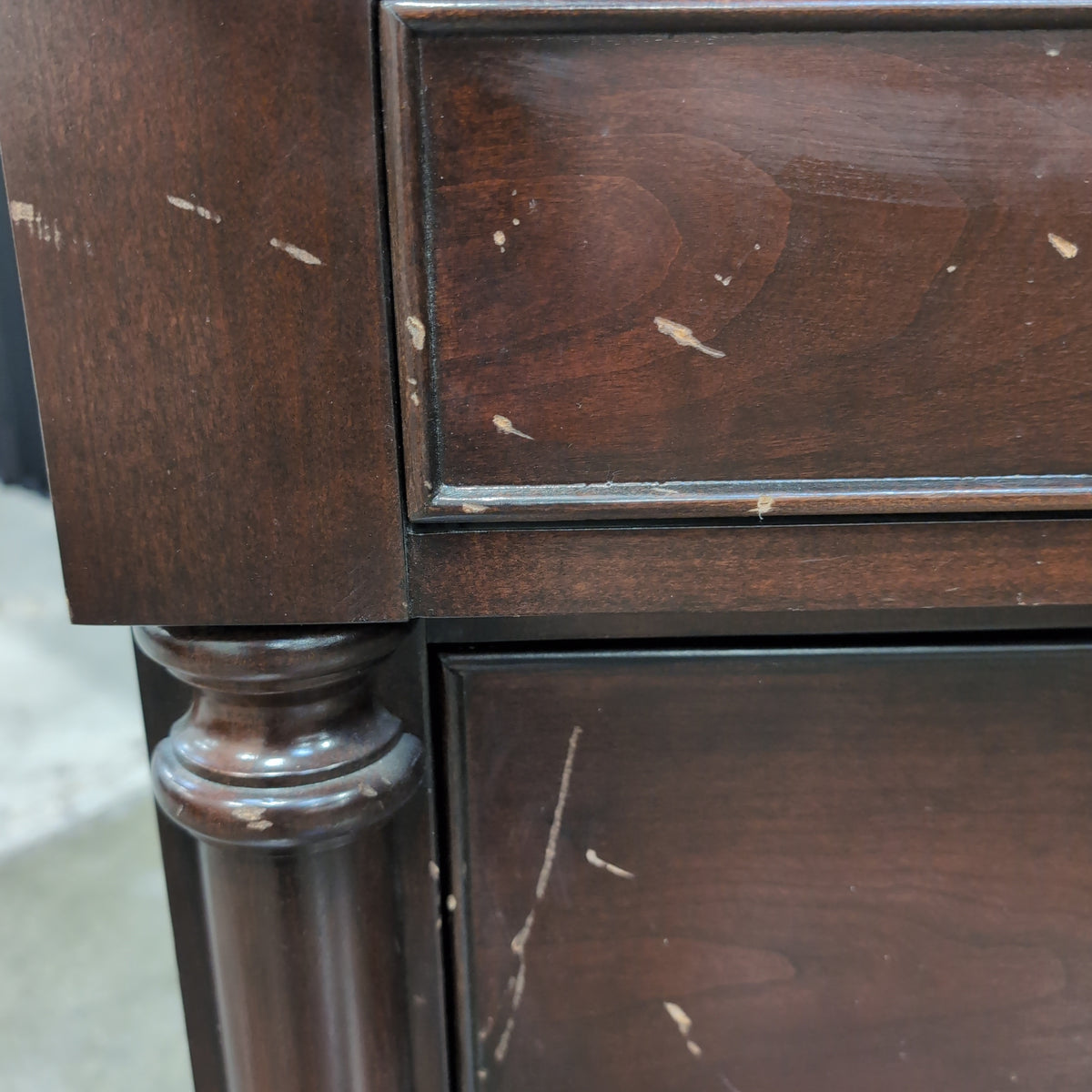 Dark Hardwood Three-Drawer Nightstand with Turned Columns
