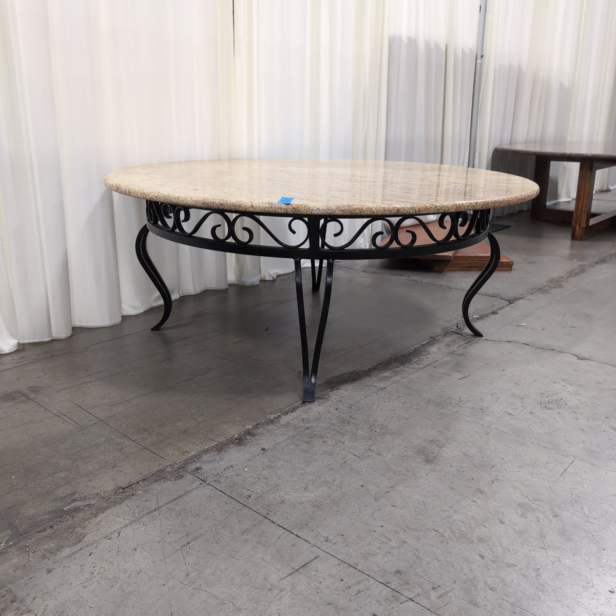 Oval Pink Speckled Granite Coffee Table with Wood Base