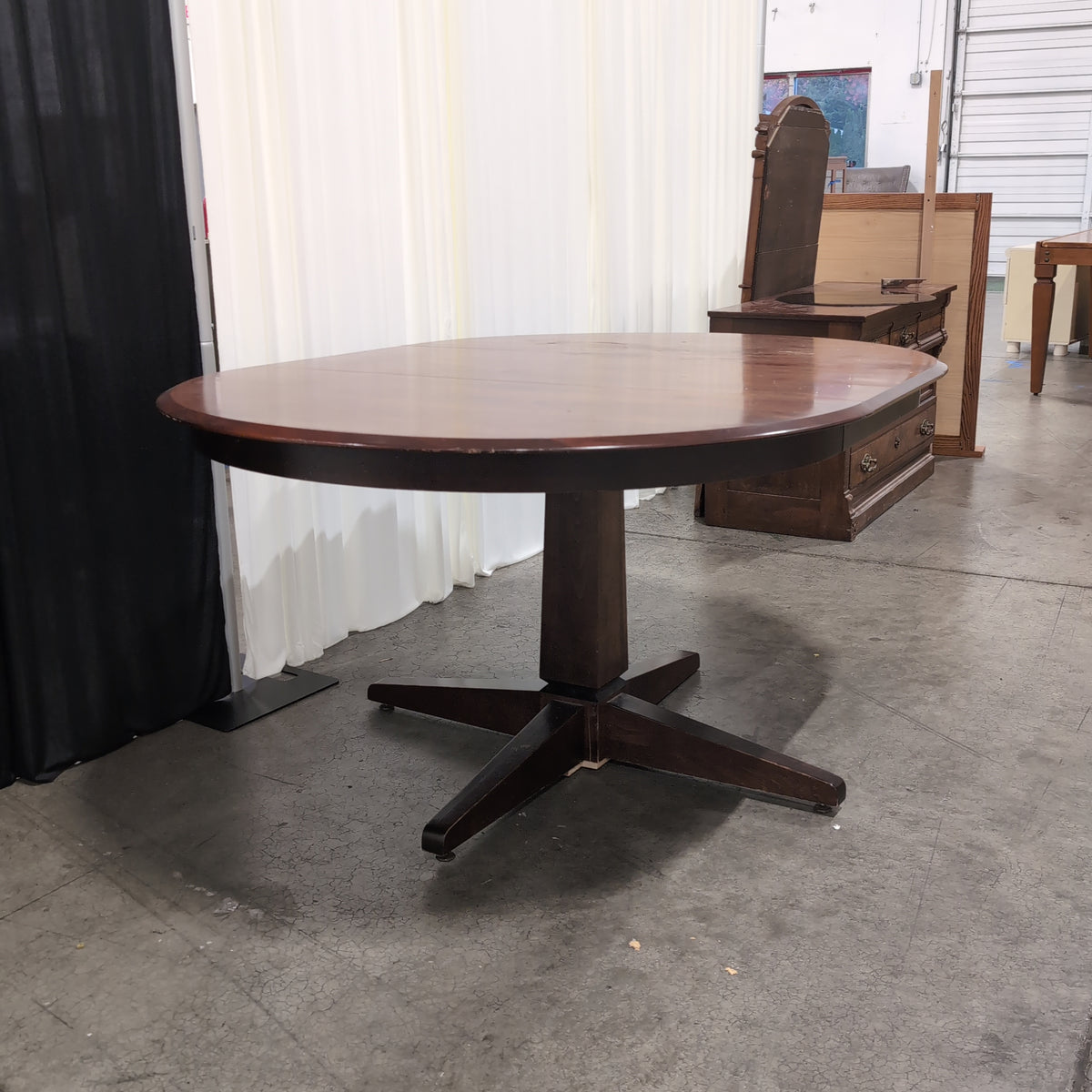 Cherry Tone Oval Wood Dining Table with Center Leaf
