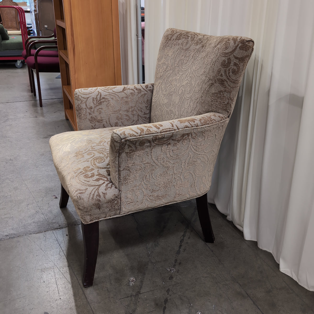 Beige Damask Upholstered Wingback Armchair with Dark Wood Legs