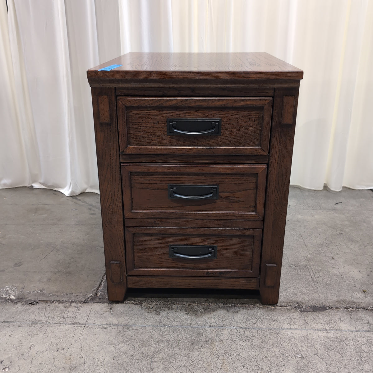 Brown Stained Hardwood Three-Drawer Nightstand with Black Hardware