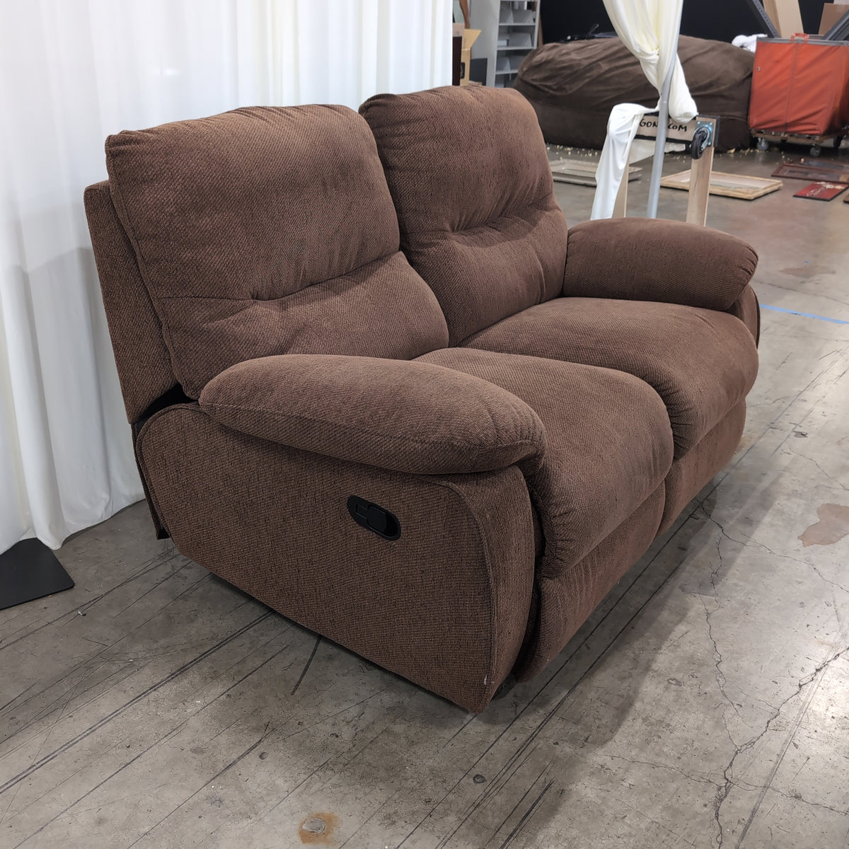 Brown Textured Fabric Reclining Loveseat with Padded Arms