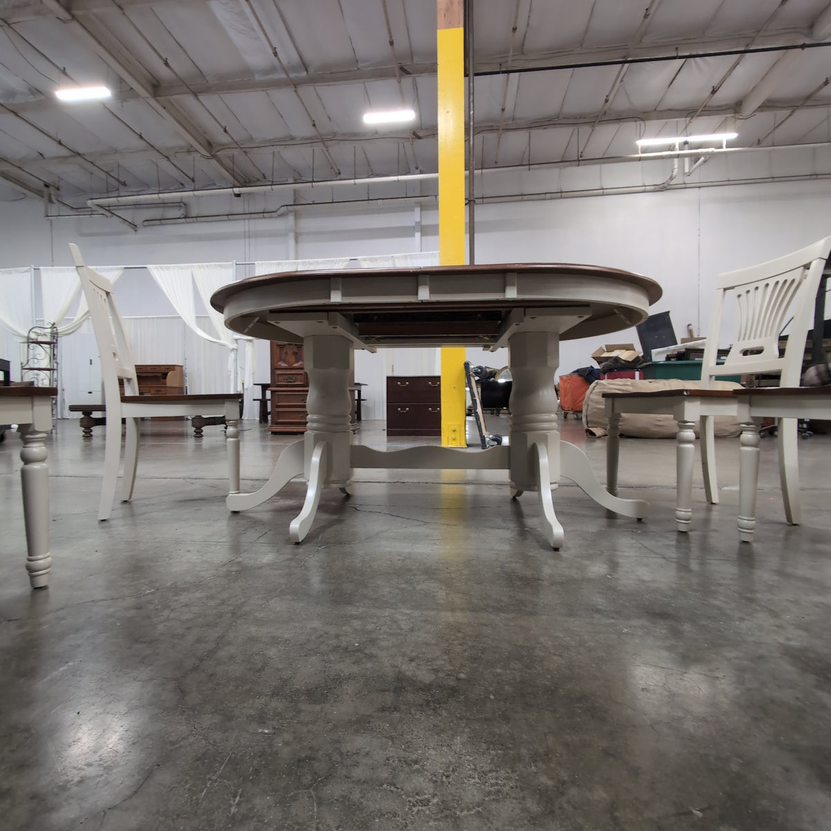 Two-Tone Extendable Dining Table with Pedestal Base