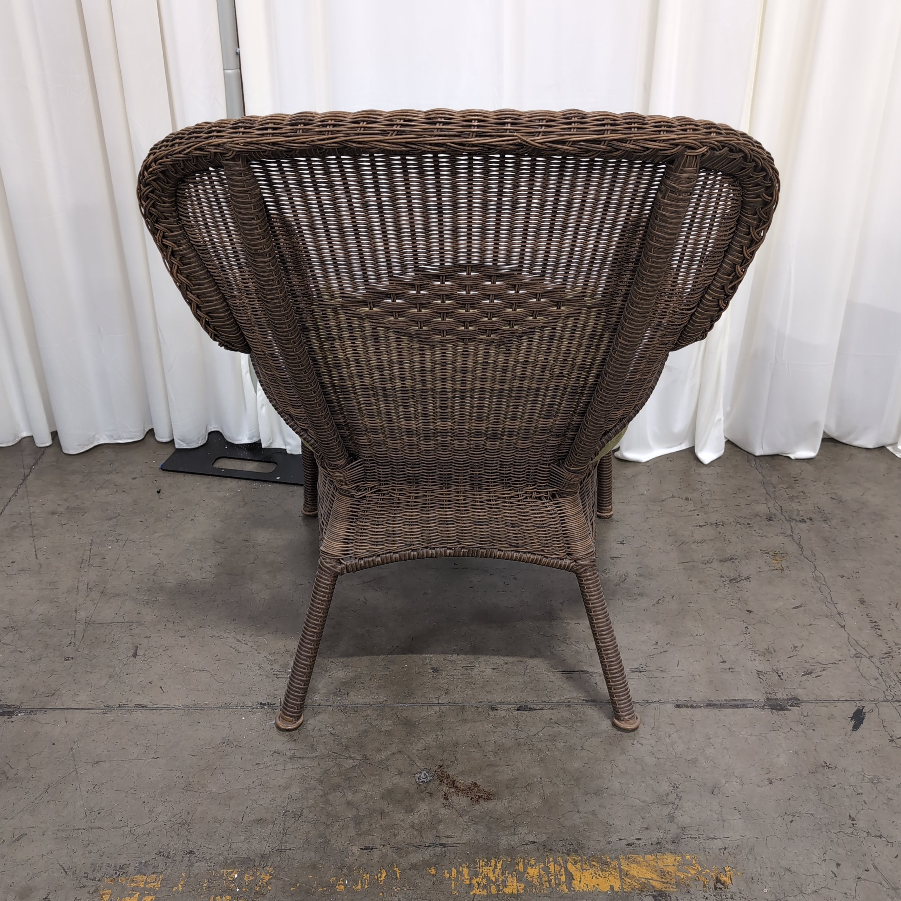 Brown Wicker Accent Chair with Green Cushion