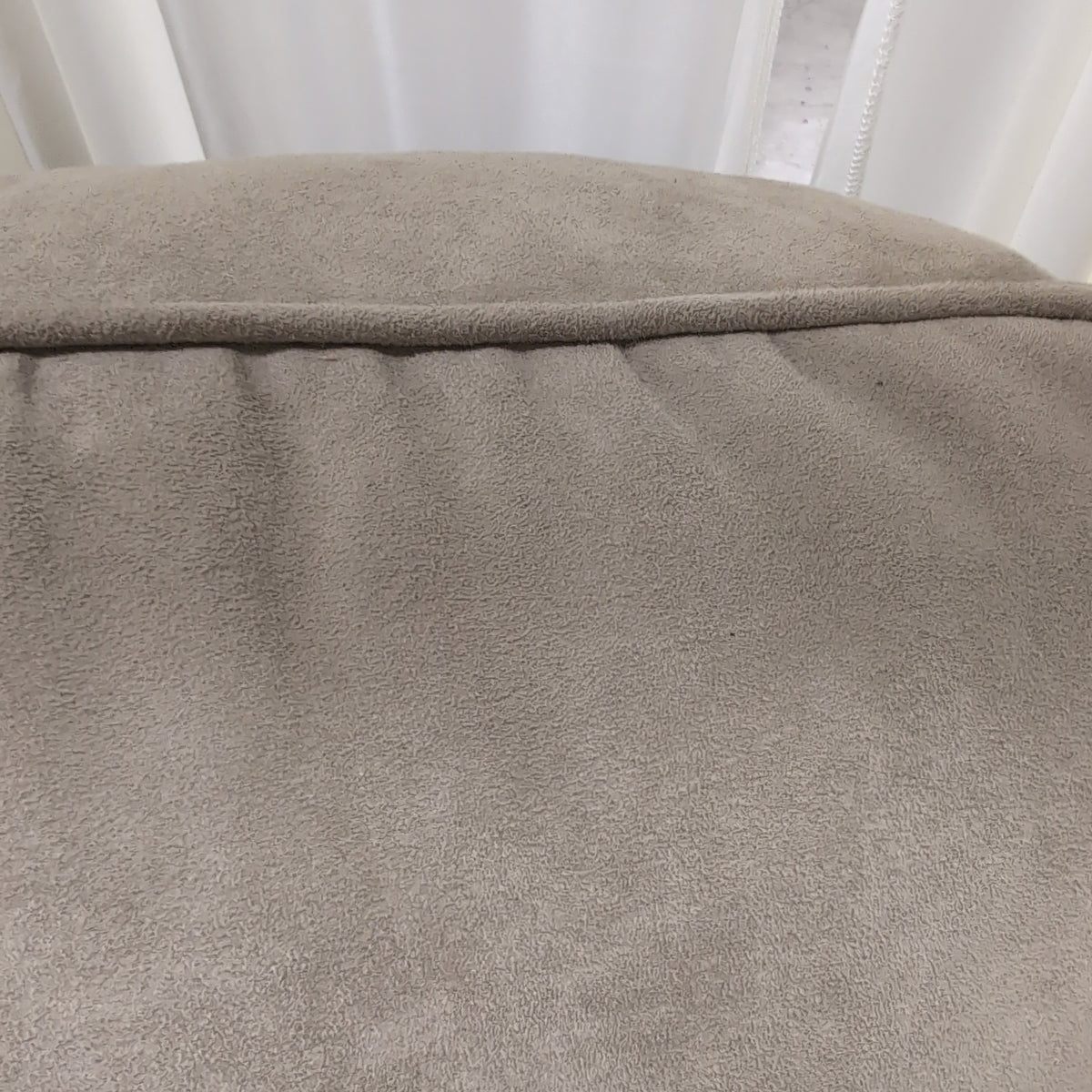 Beige Upholstered Three-Seat Couch with Rolled Arms