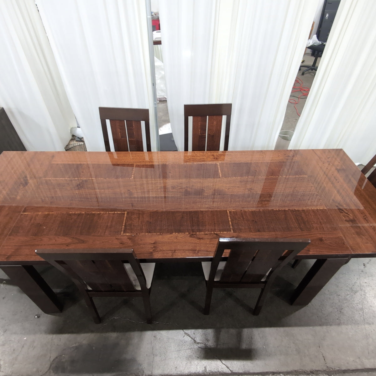 Chestnut brown dining table with 6 matching chairs
