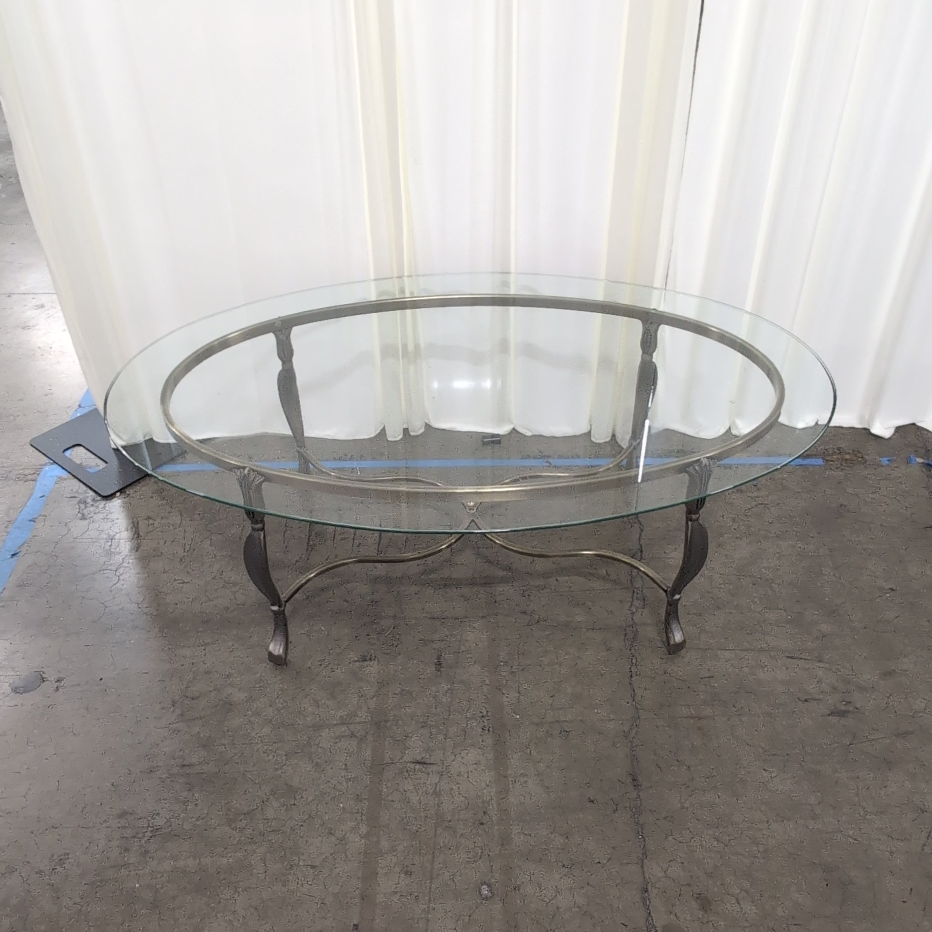 Oval Glass Coffee Table with Ornate Metal Base