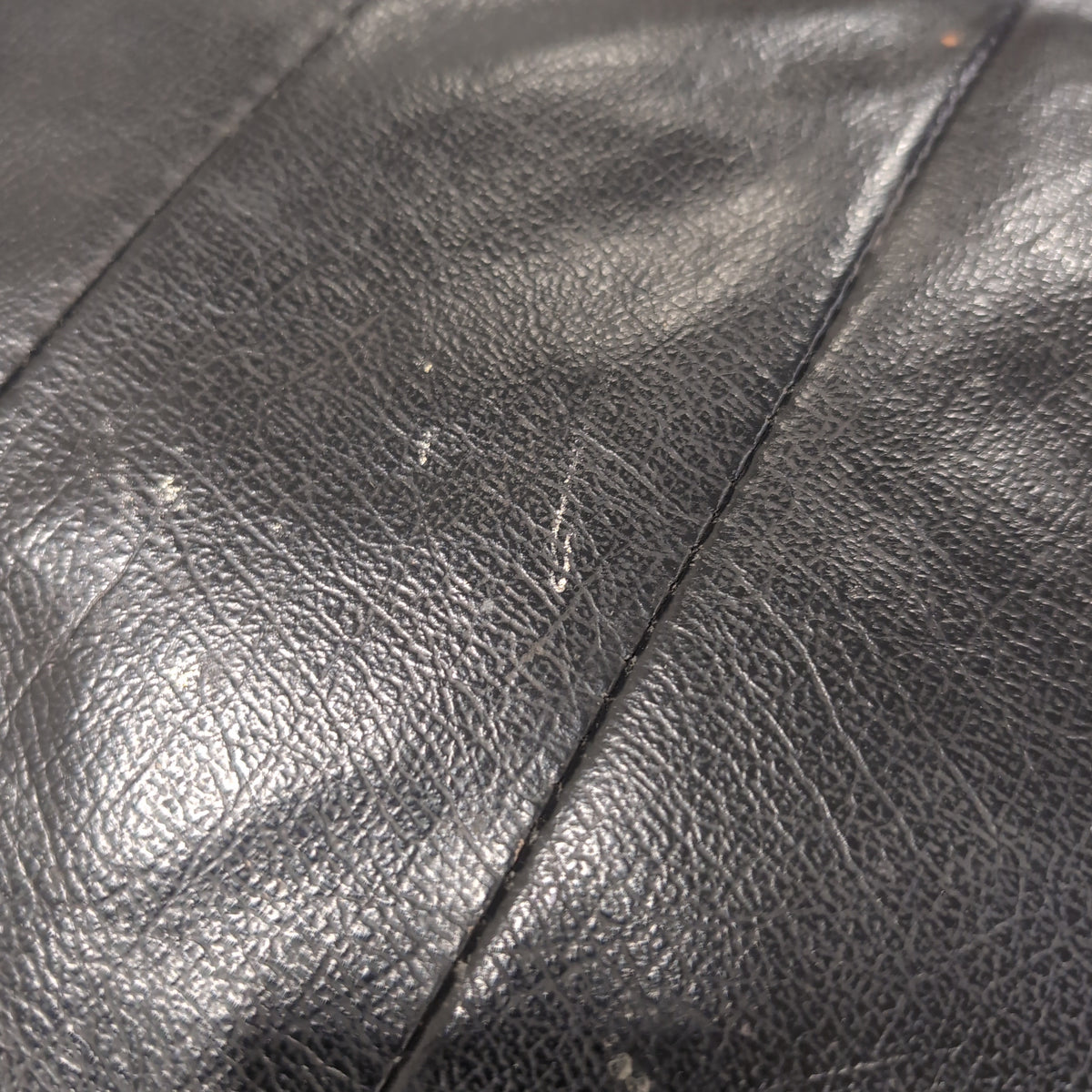 Black Tufted Leather Swivel Recliner with Ottoman