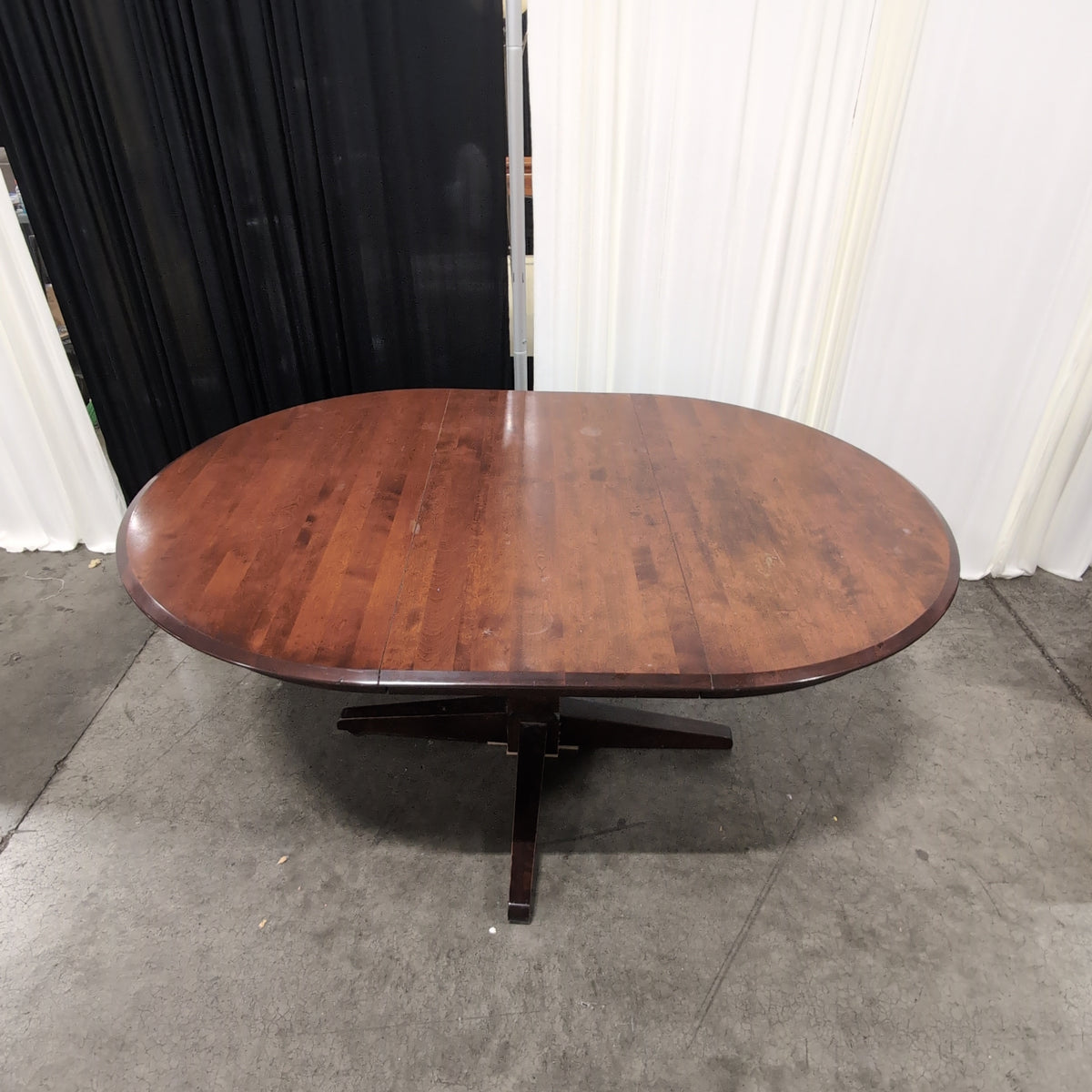 Cherry Tone Oval Wood Dining Table with Center Leaf