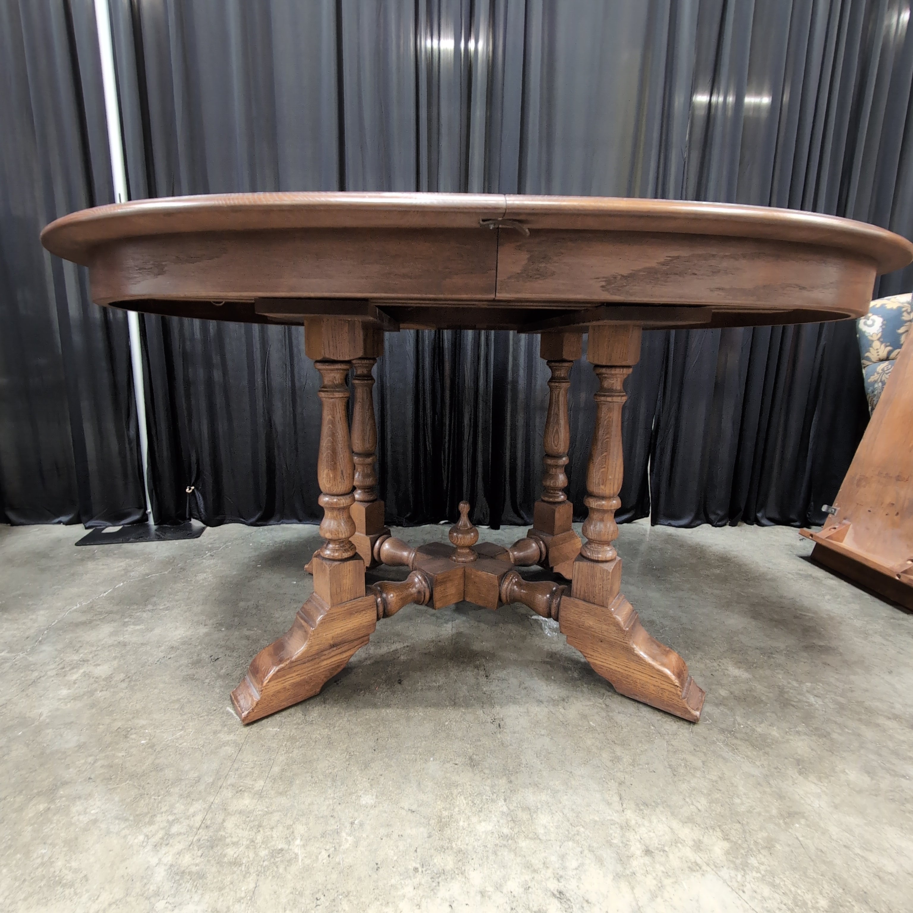 Round Brown Wood Dining Table with Drop Leaves