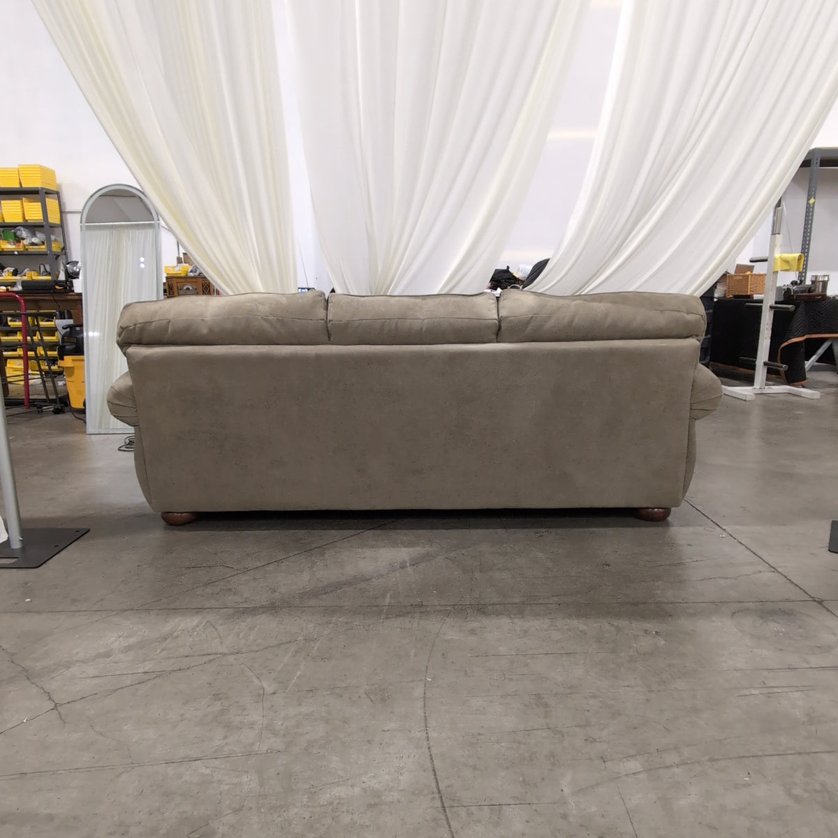 Beige Upholstered Three-Seat Couch with Rolled Arms