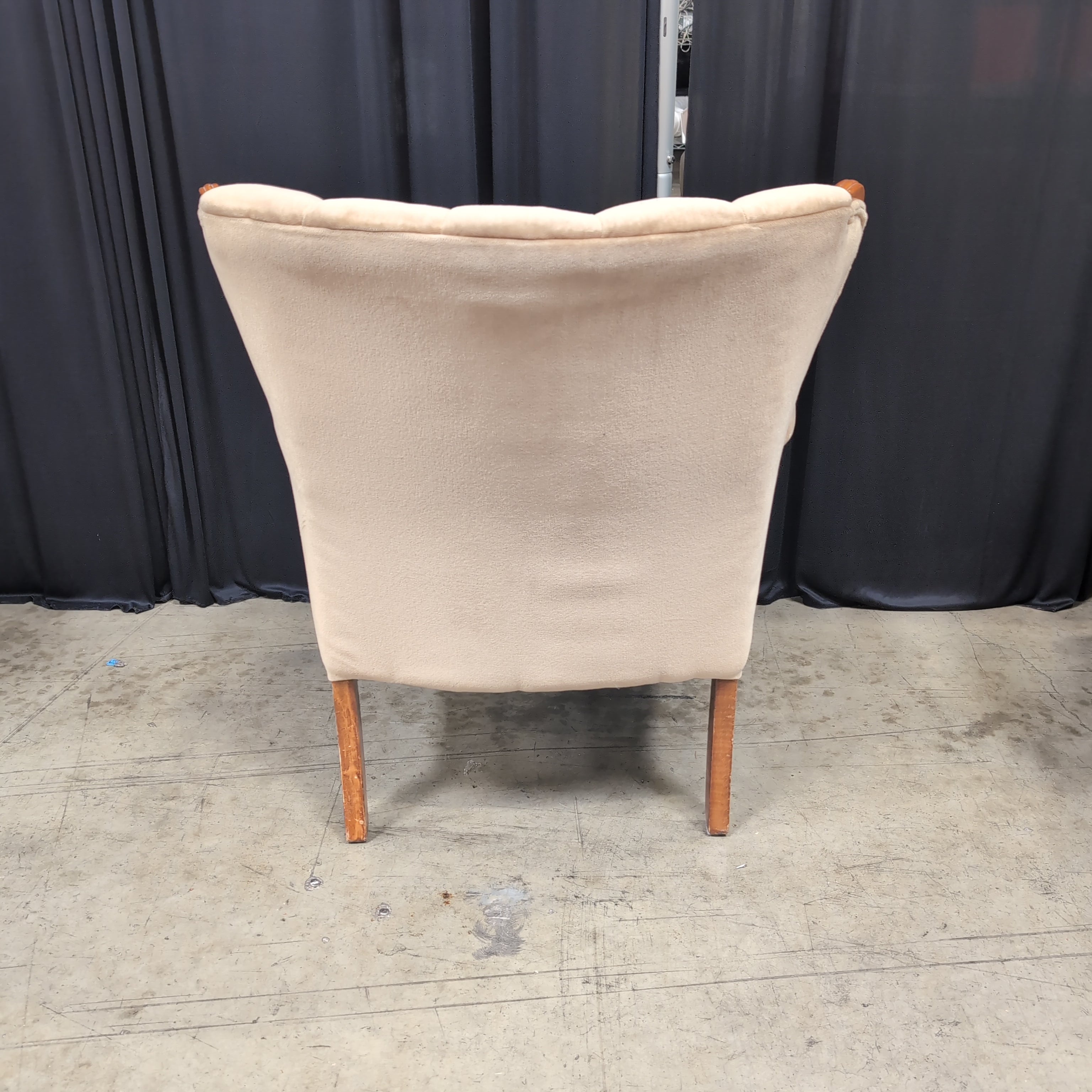 Tan Upholstered Shell Back Armchair with Carved Wood