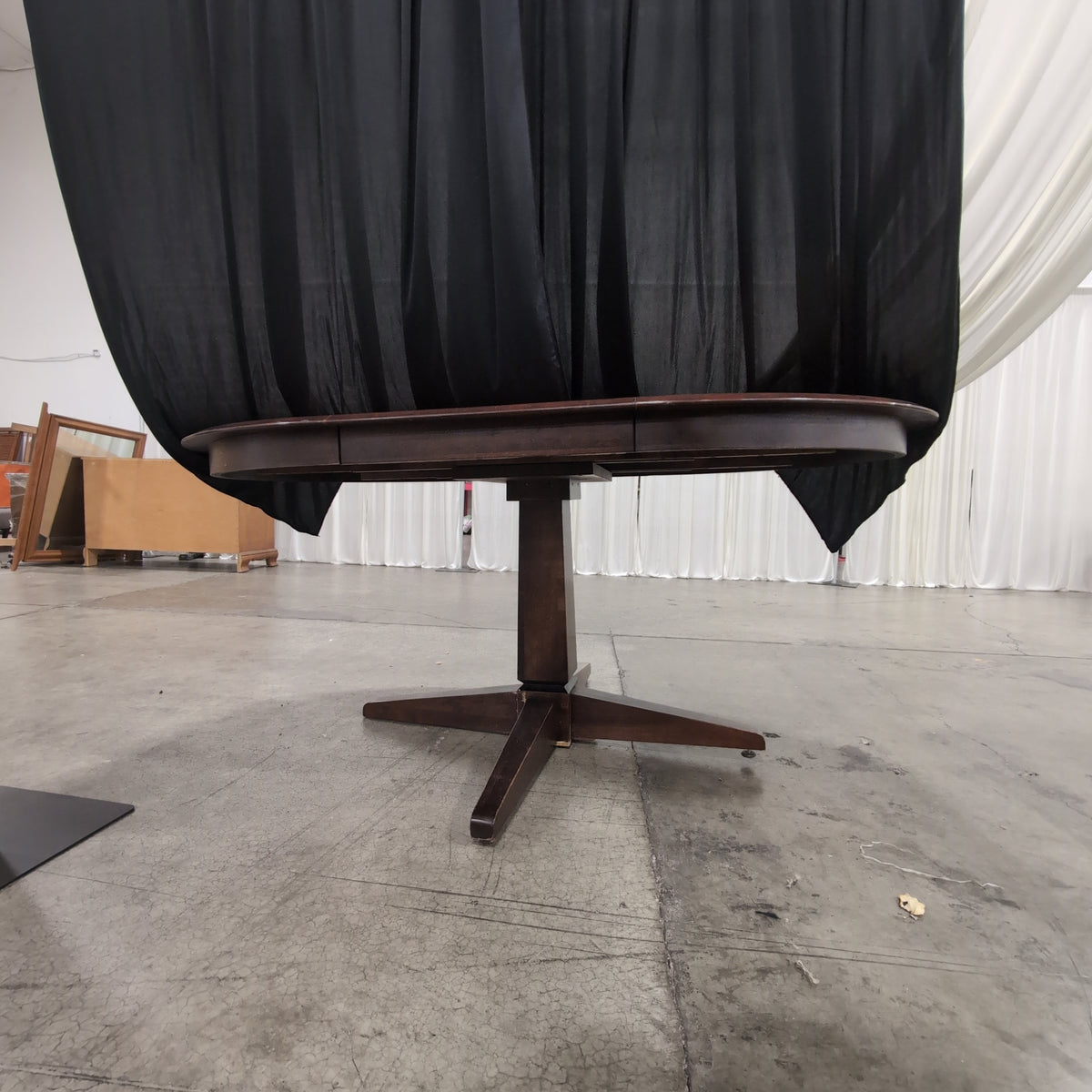 Cherry Tone Oval Wood Dining Table with Center Leaf