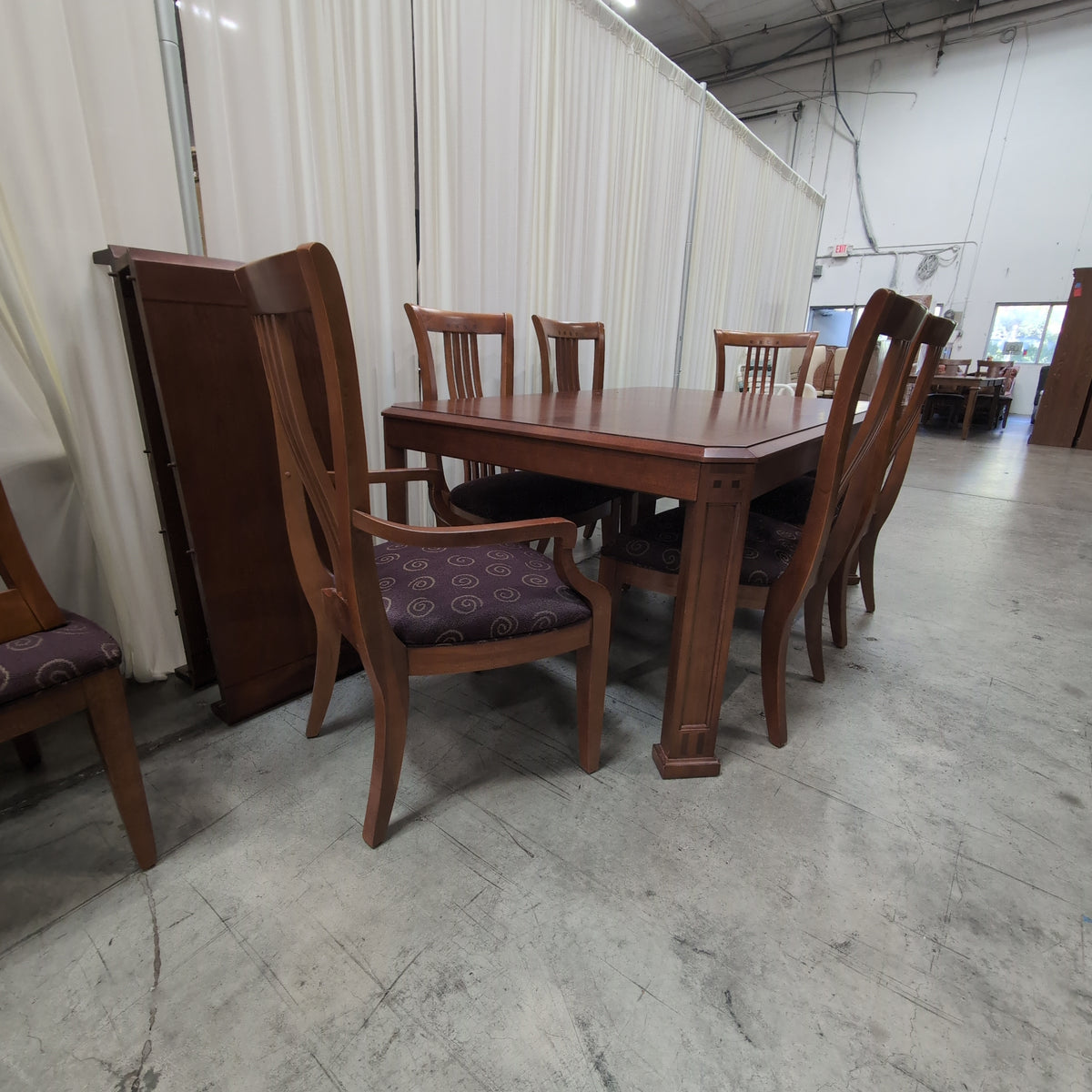 Dark Stained Wood Dining Table with Chamfered Corners