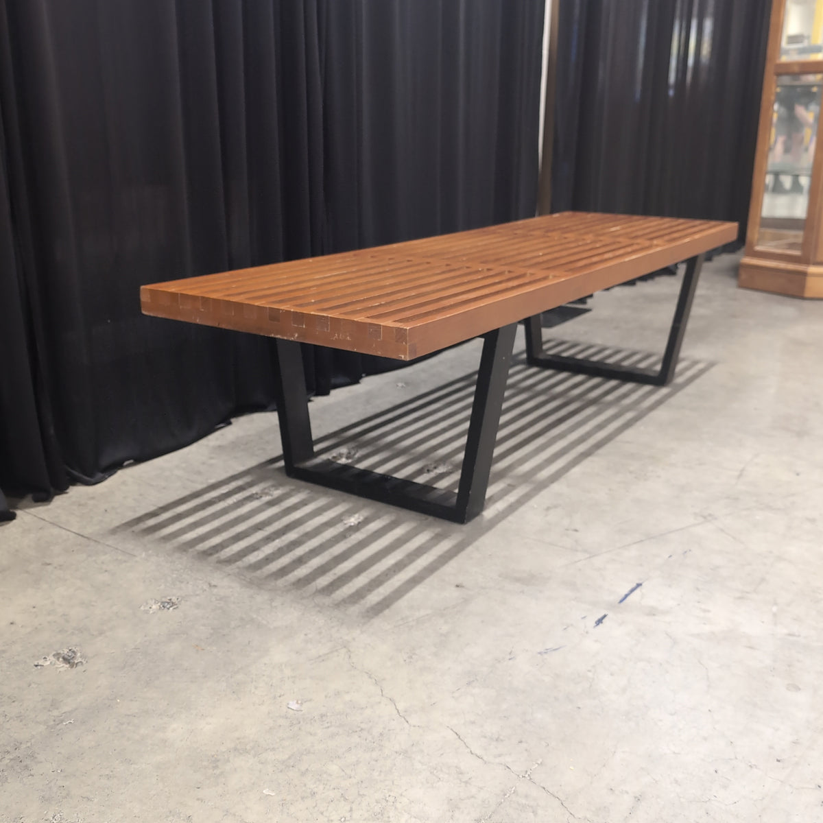 Brown Slatted Outdoor Bench in Hardwood