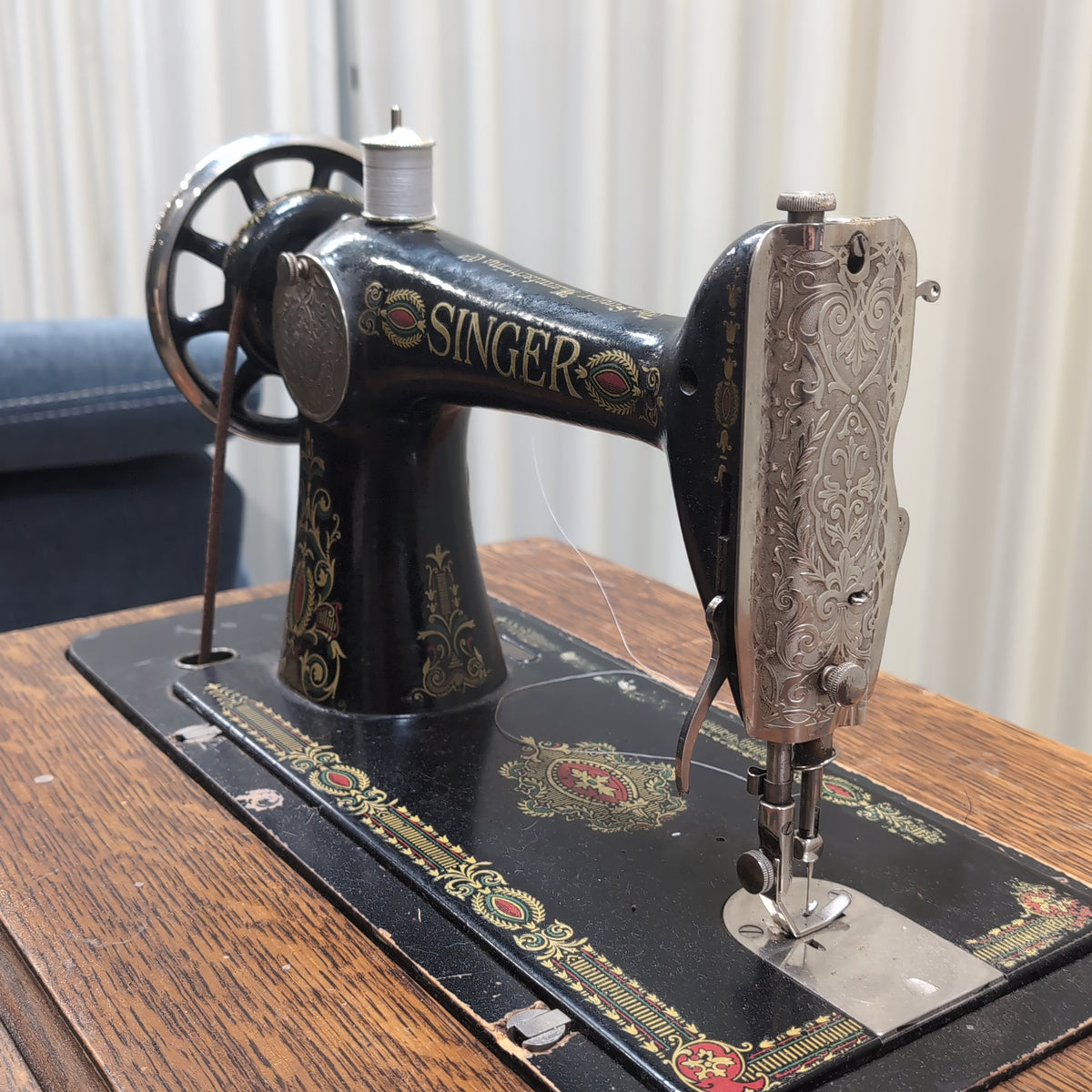 Vintage SINGER Sewing Machine with Dark Wood Cabinet