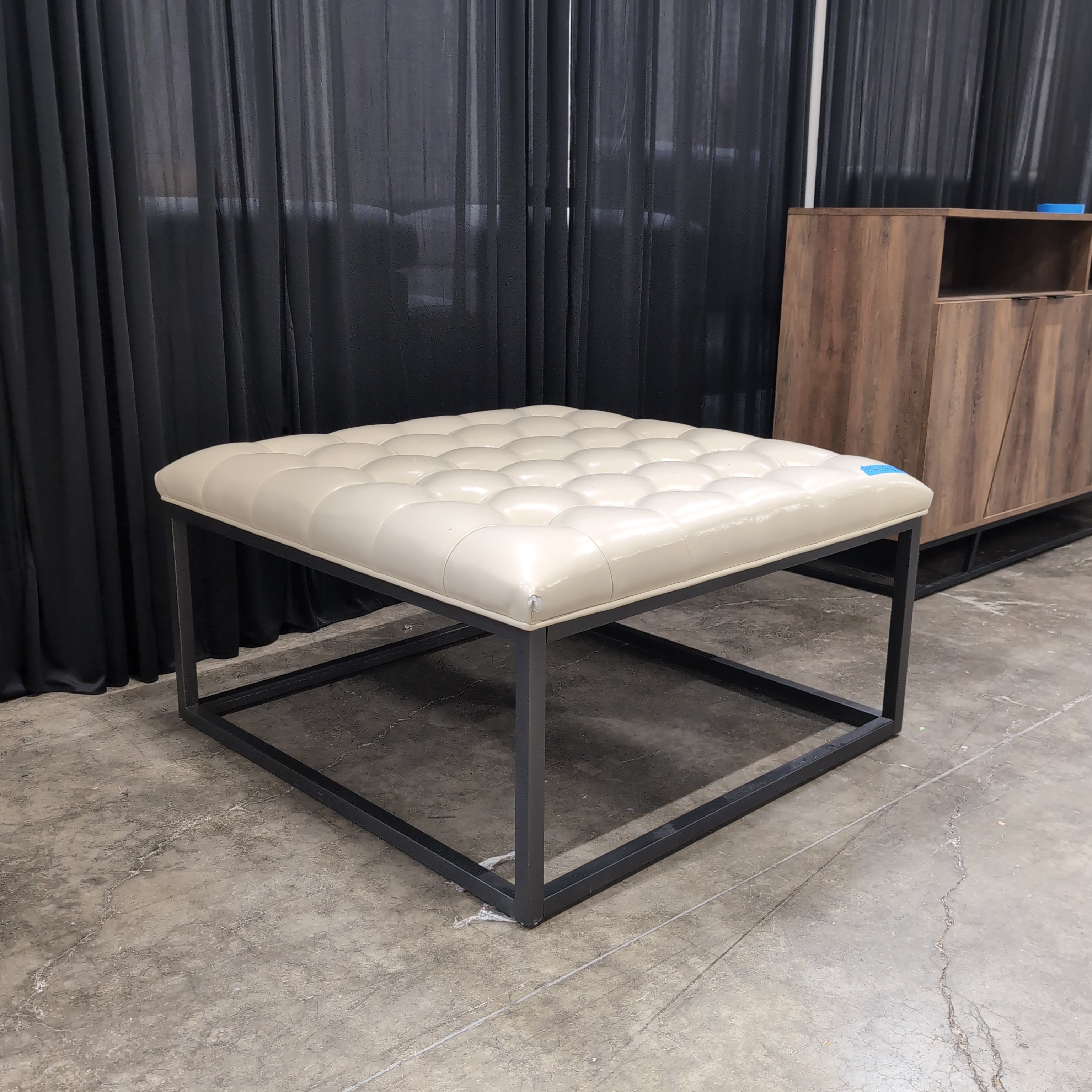 Cream Tufted Faux Leather Ottoman with Metal Base