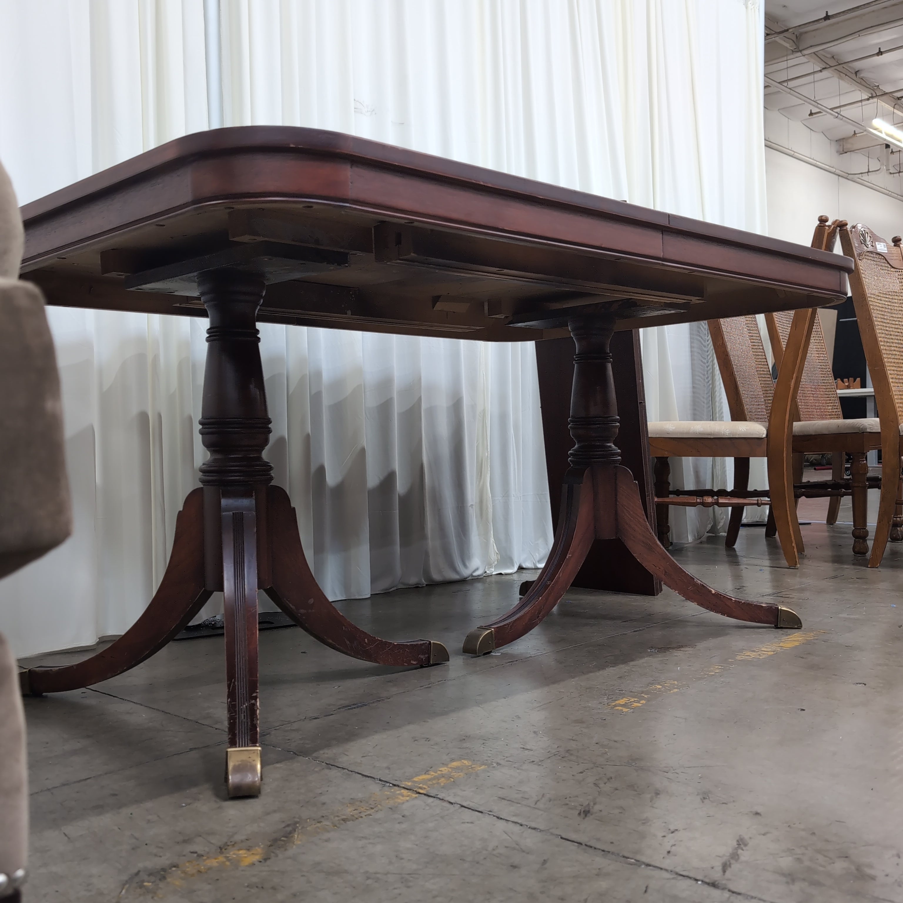 Reddish Brown Hardwood Dining Table with Rounded Corners