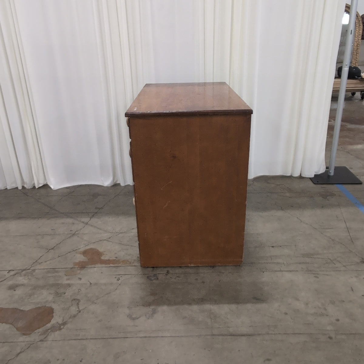 Brown Wood Four-Drawer Desk with Round Knobs