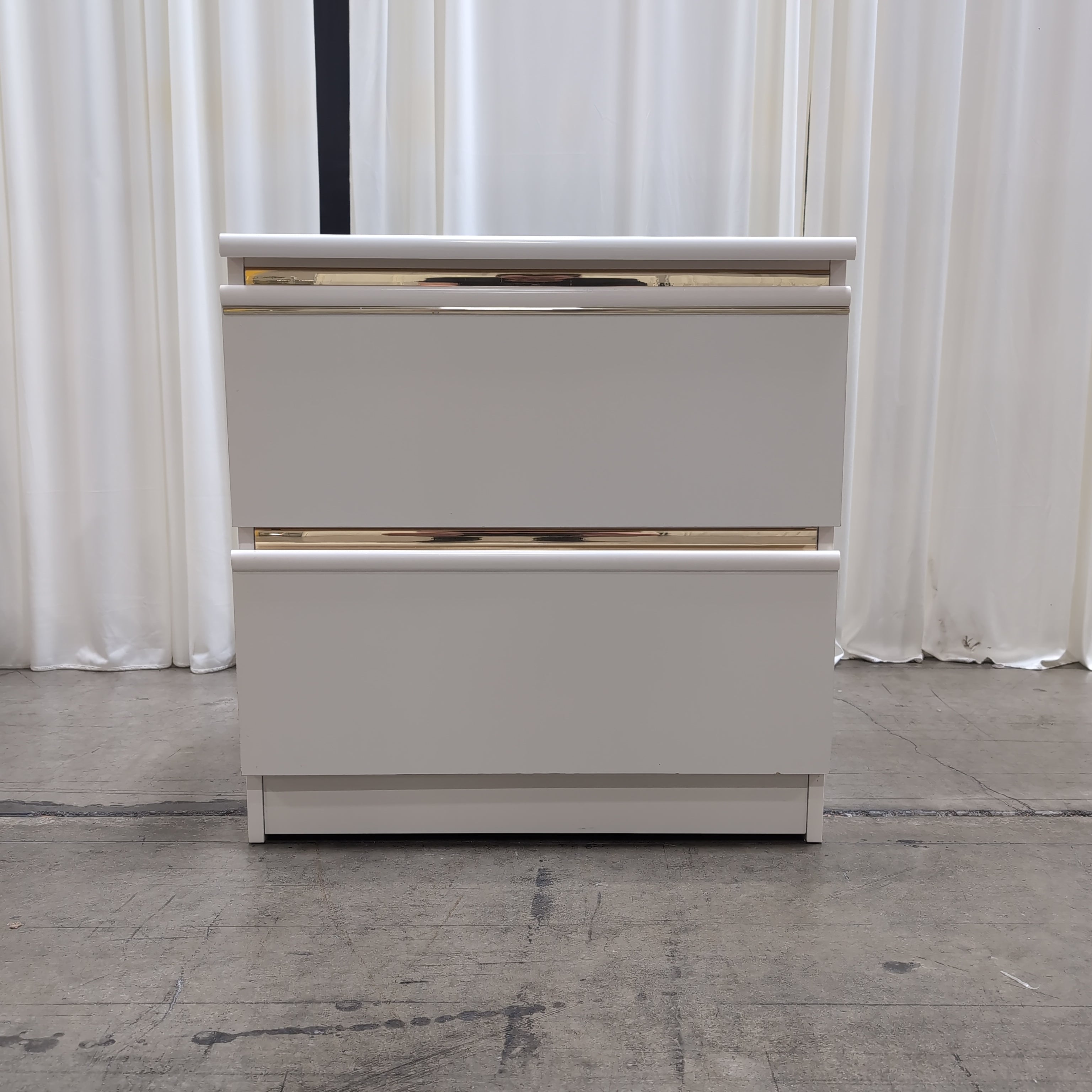 White Two-Drawer Nightstand with Gold Accents