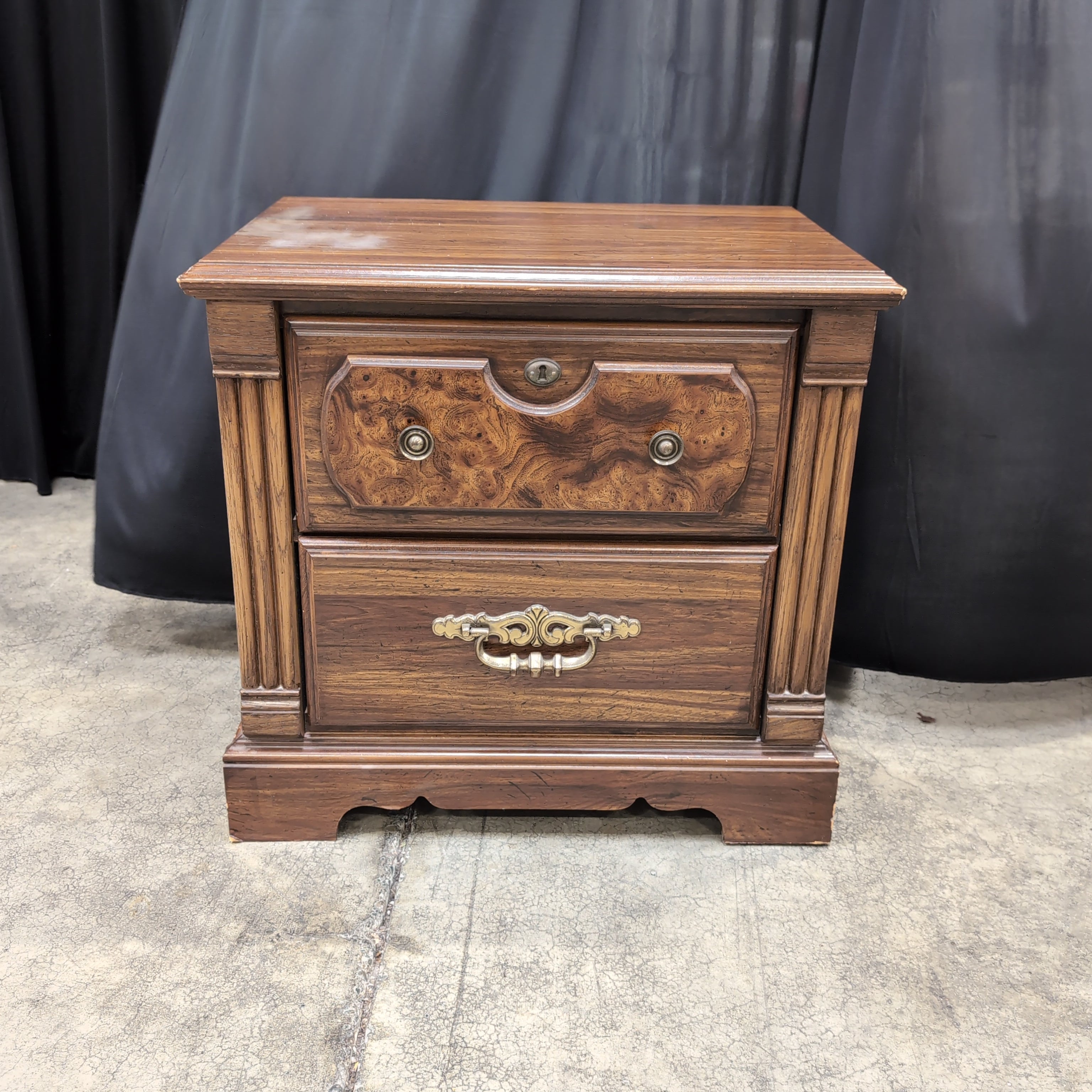 Traditional Dark Wood Two-Drawer Nightstand with Ornate Hardware