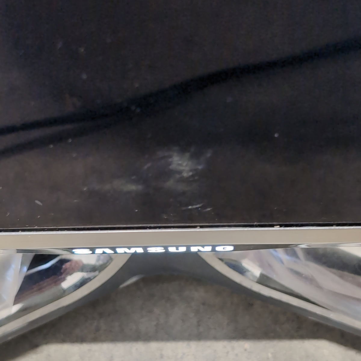 Samsung Modern Black Flat-Screen TV with Silver Stand