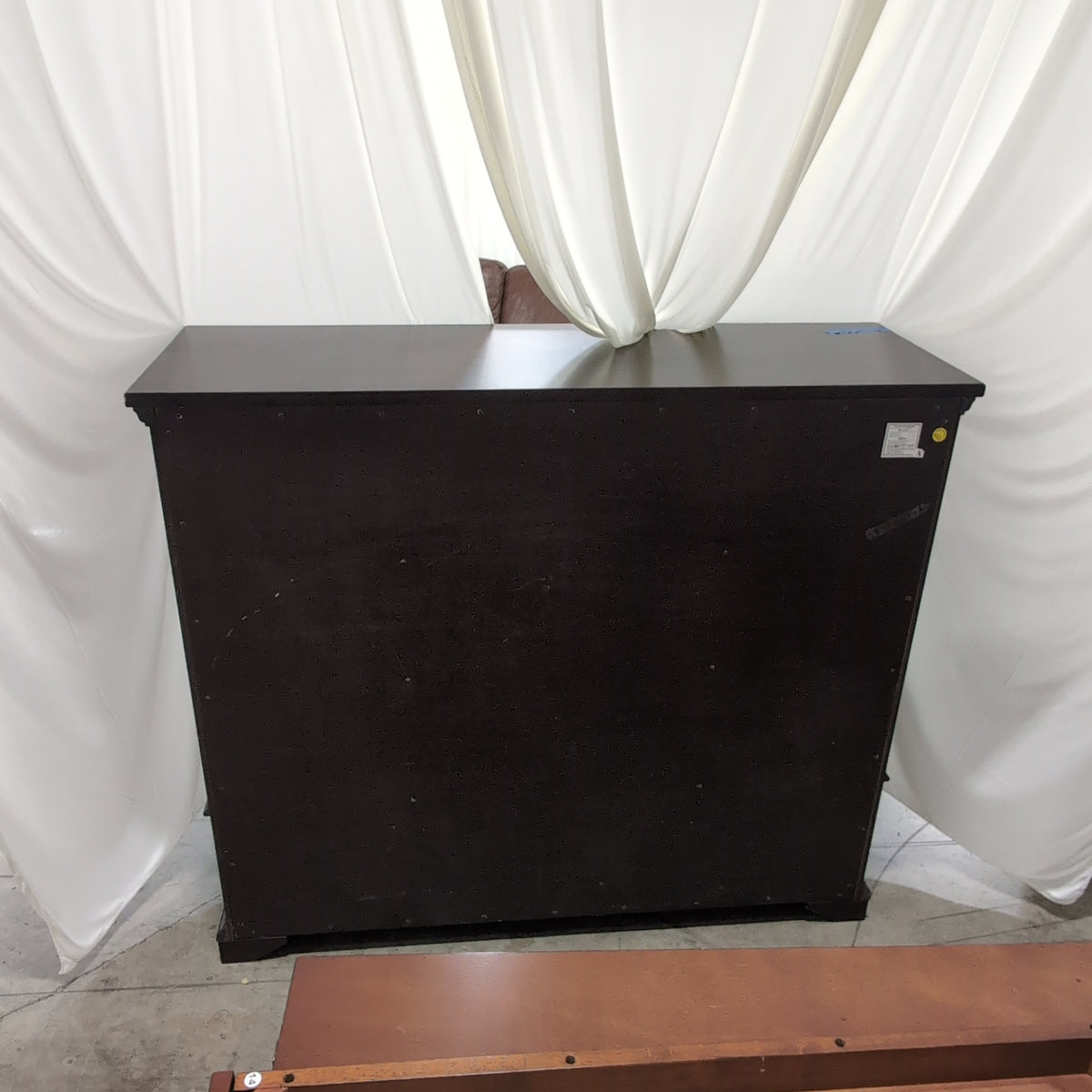Dark Brown Wood Eight-Drawer Dresser with Ornate Hardware