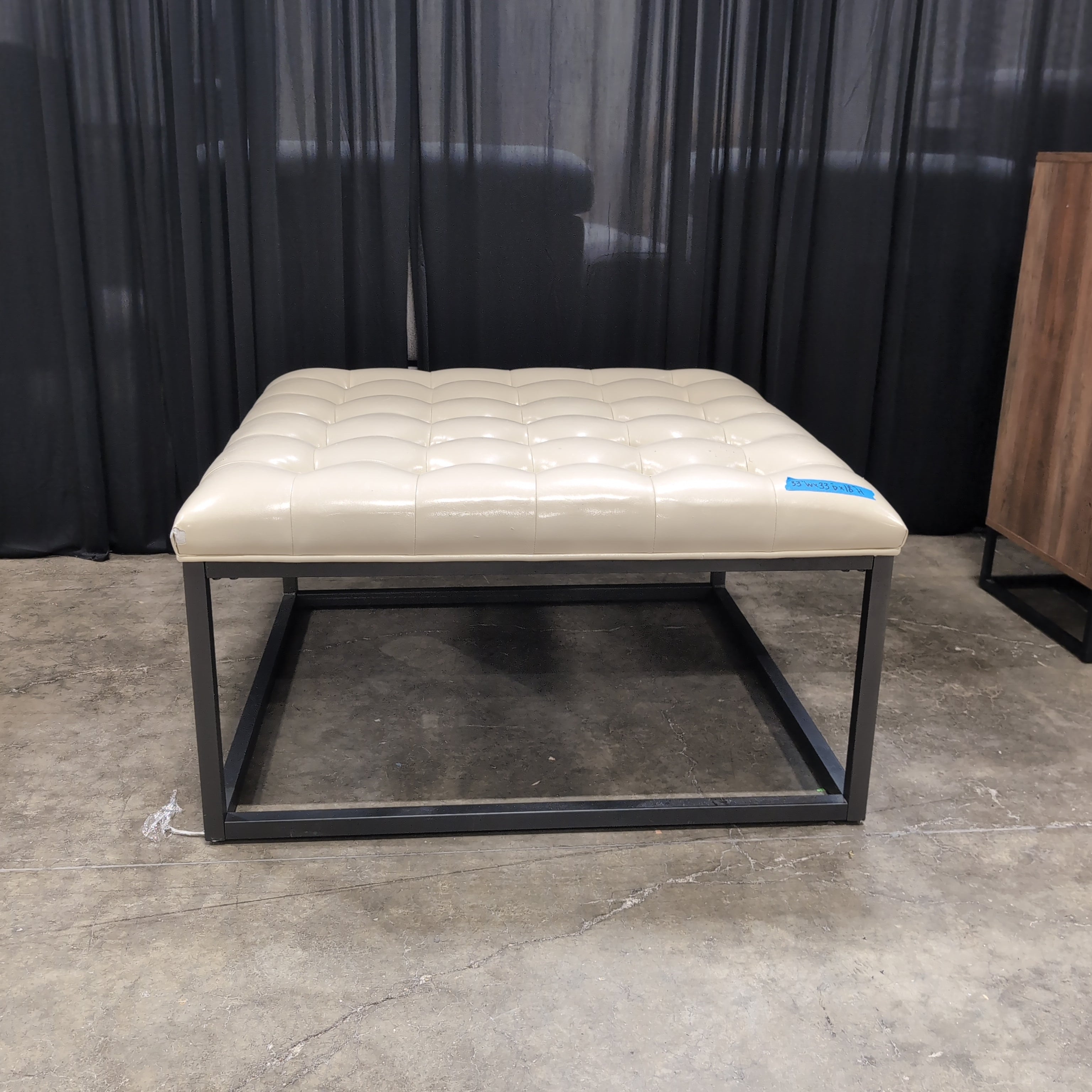 Cream Tufted Faux Leather Ottoman with Metal Base